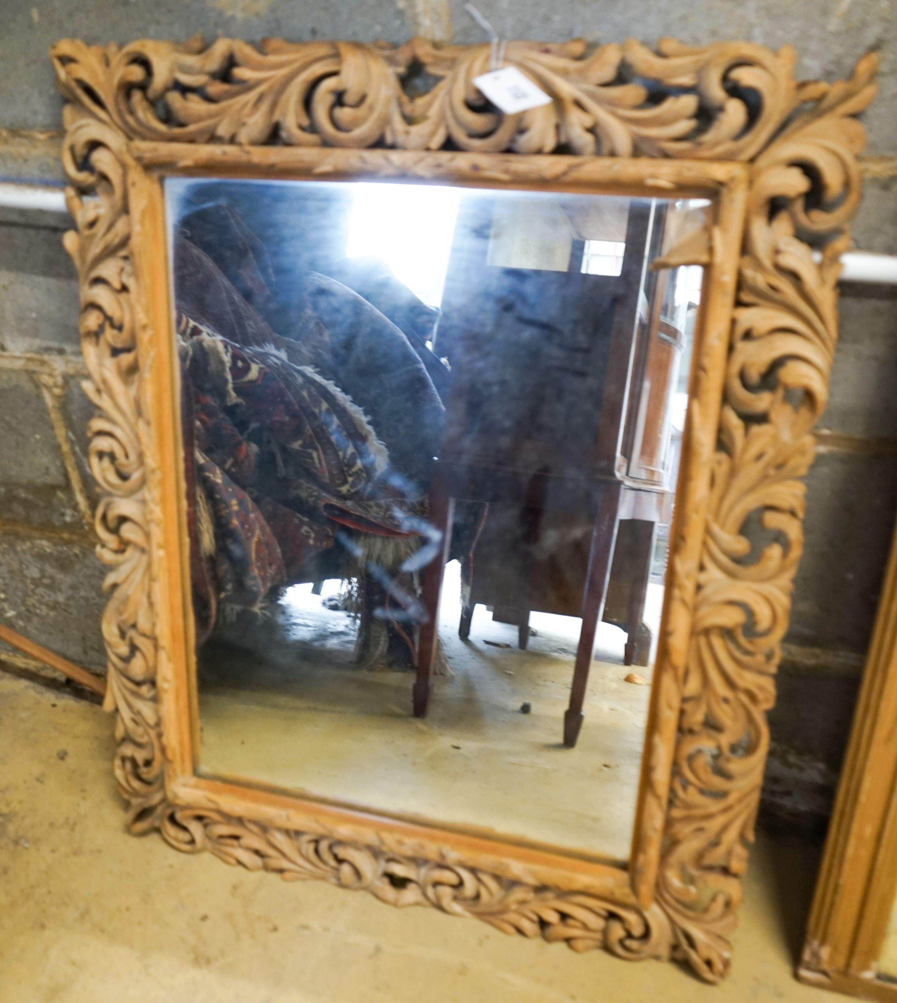 A carved oak framed rectangular wall mirror, width 65cm, height 82cm                                                                                                                                                        
