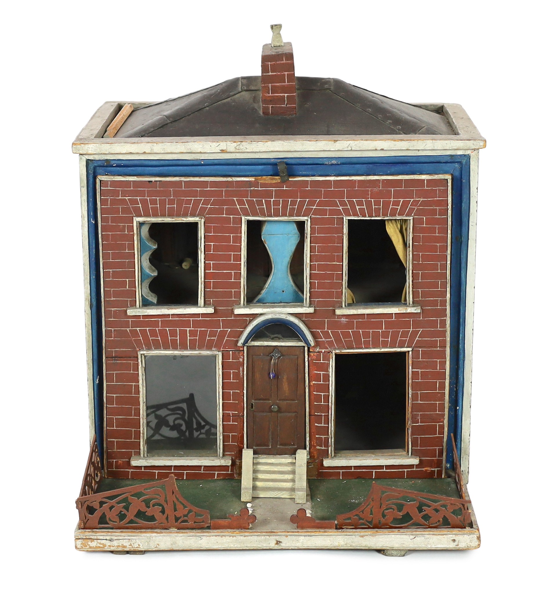 An extraordinary English dolls’ house, mid 19th century, 62cm high                                                                                                                                                          