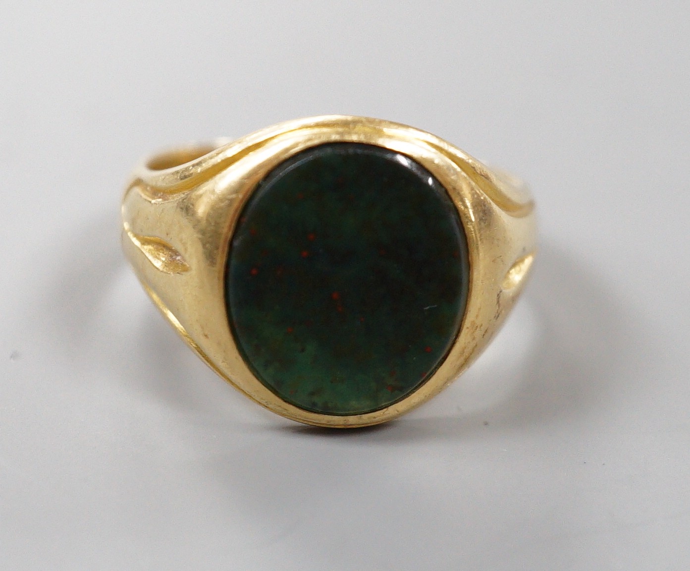 A late Victorian 18ct gold and oval bloodstone set signet ring, size O, gross weight 6.9 grams.                                                                                                                             