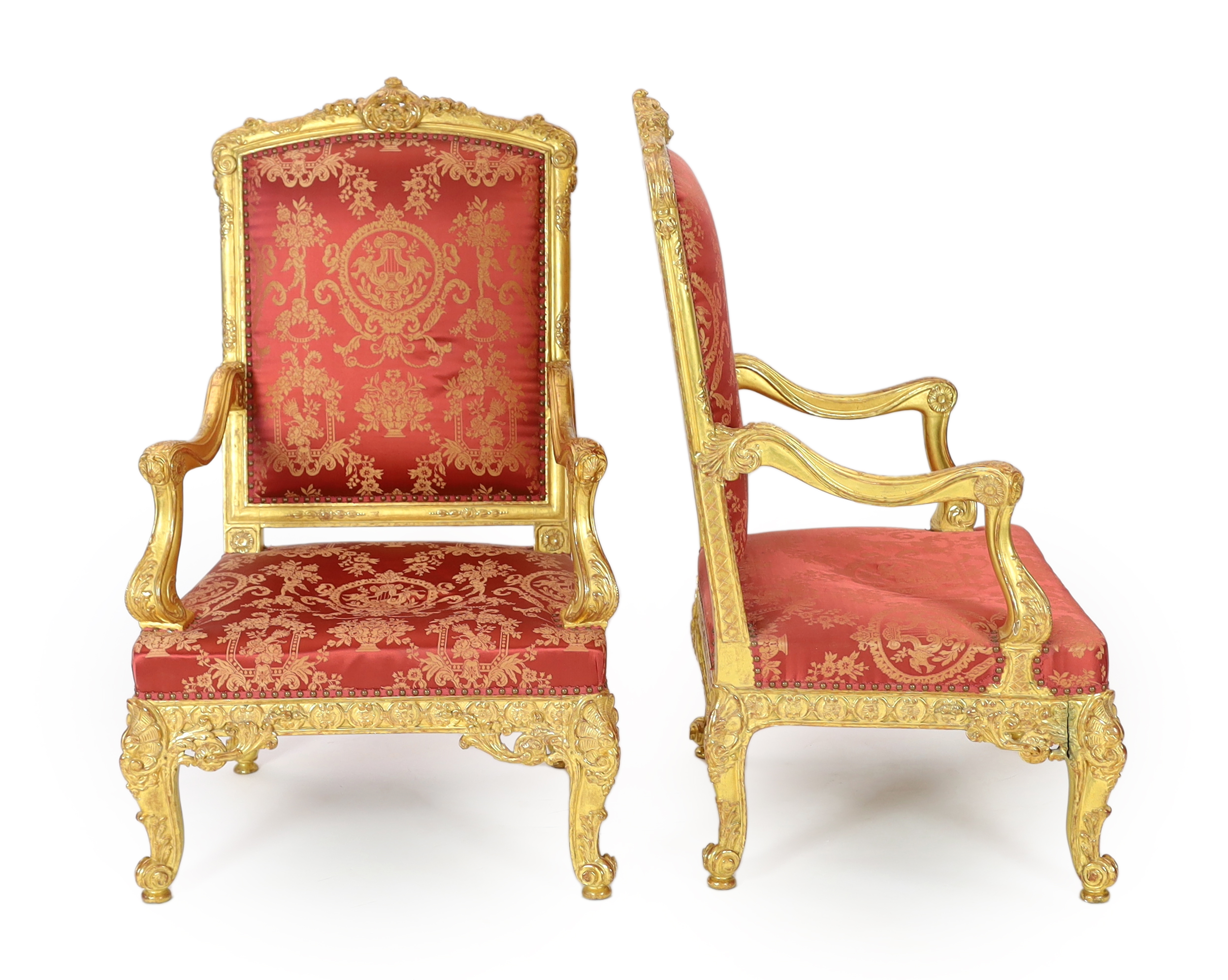 A pair of Louis XV style carved giltwood fauteuils, 78cm wide, 76cm deep, 125cm high, Please note this lot attracts an additional import tax of 5% on the hammer price                                                      