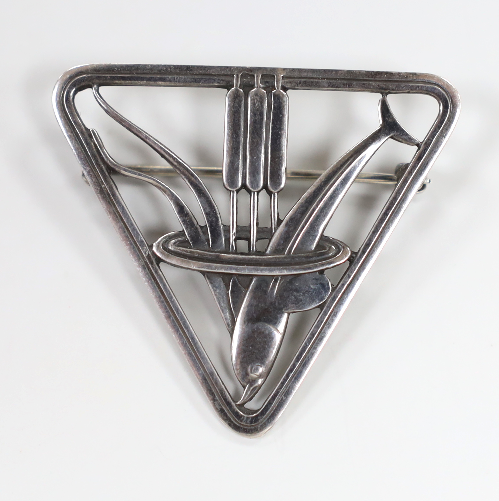 A Georg Jensen sterling 'dolphin amongst reeds' triangular brooch, design no. 257, 37mm.                                                                                                                                    