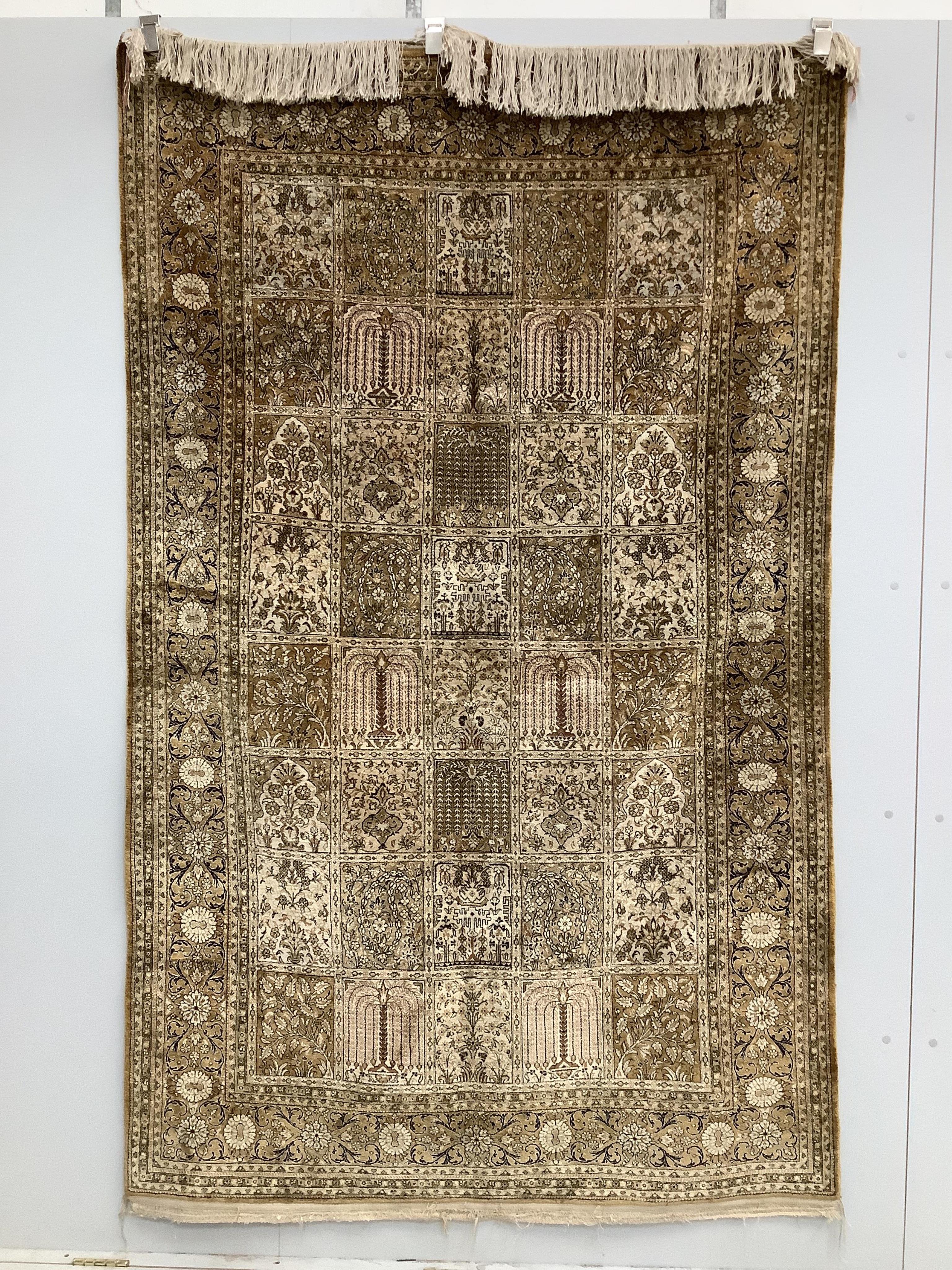 A Kashmir ‘silk’ rug, woven all over with rectangles filled with stylised flowers, 220 x 138cm                                                                                                                              