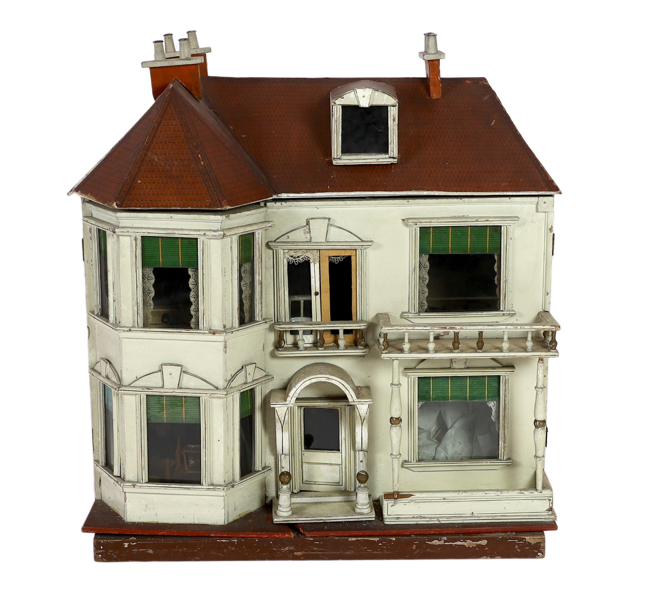 A G. and J. Lines furnished dolls’ house of 'Kits Koty' type, early 20th century, 92cm high.                                                                                                                                