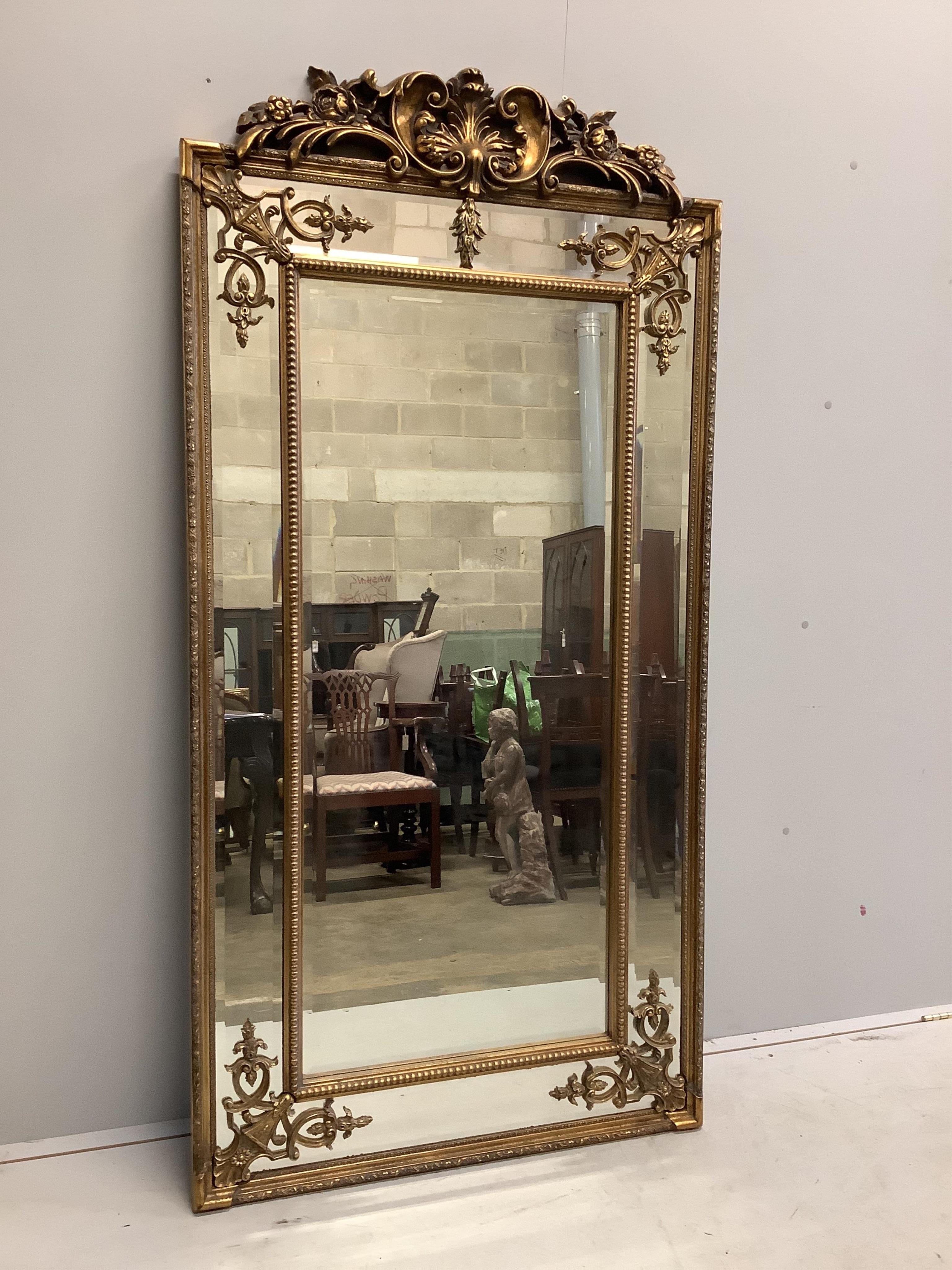 A Victorian style rectangular gilt composition wall mirror, width 91cm, height 184cm. Condition - good                                                                                                                      