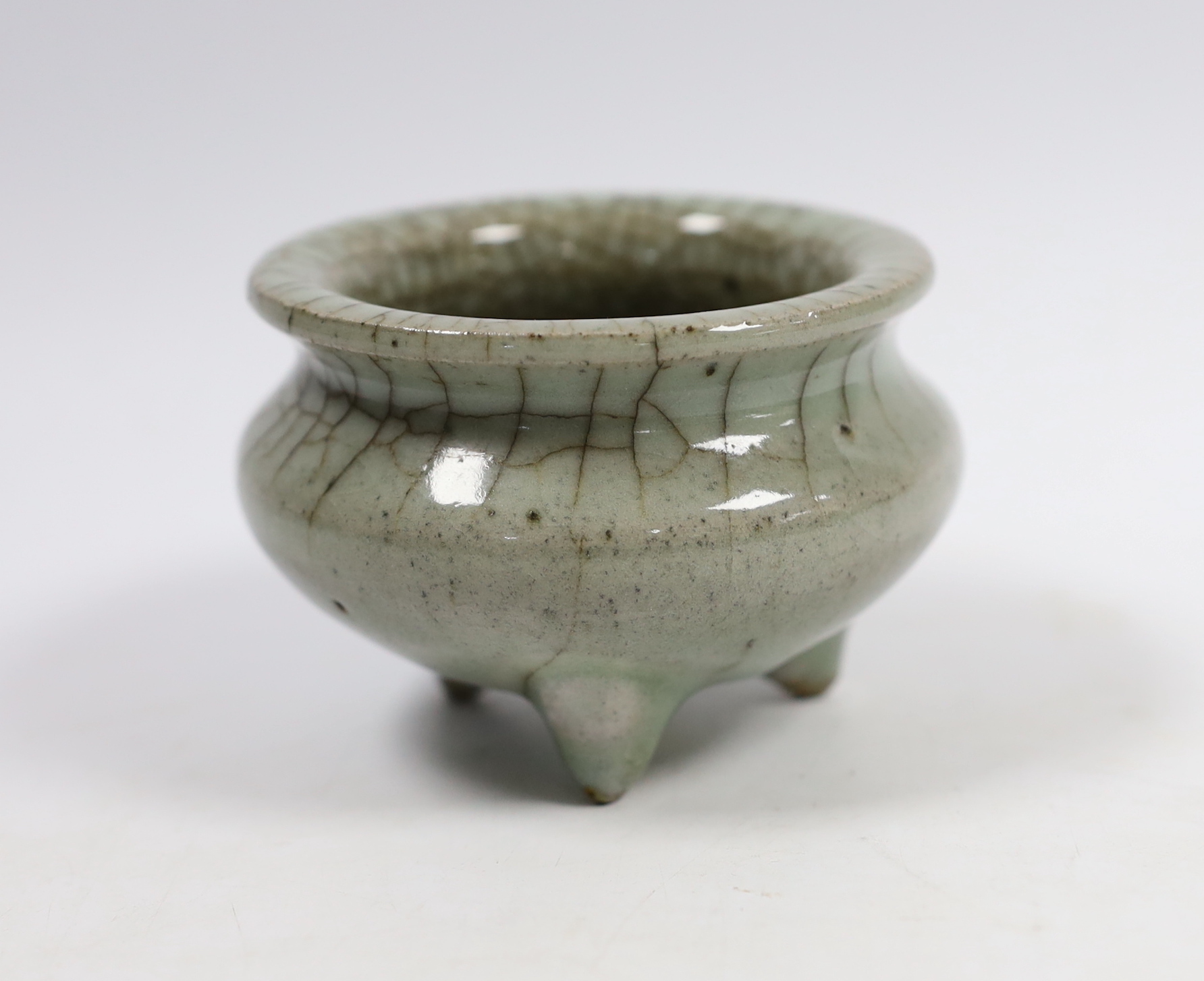 A Chinese Guan type tripod censer, possibly Ming dynasty, 8cm diameter                                                                                                                                                      