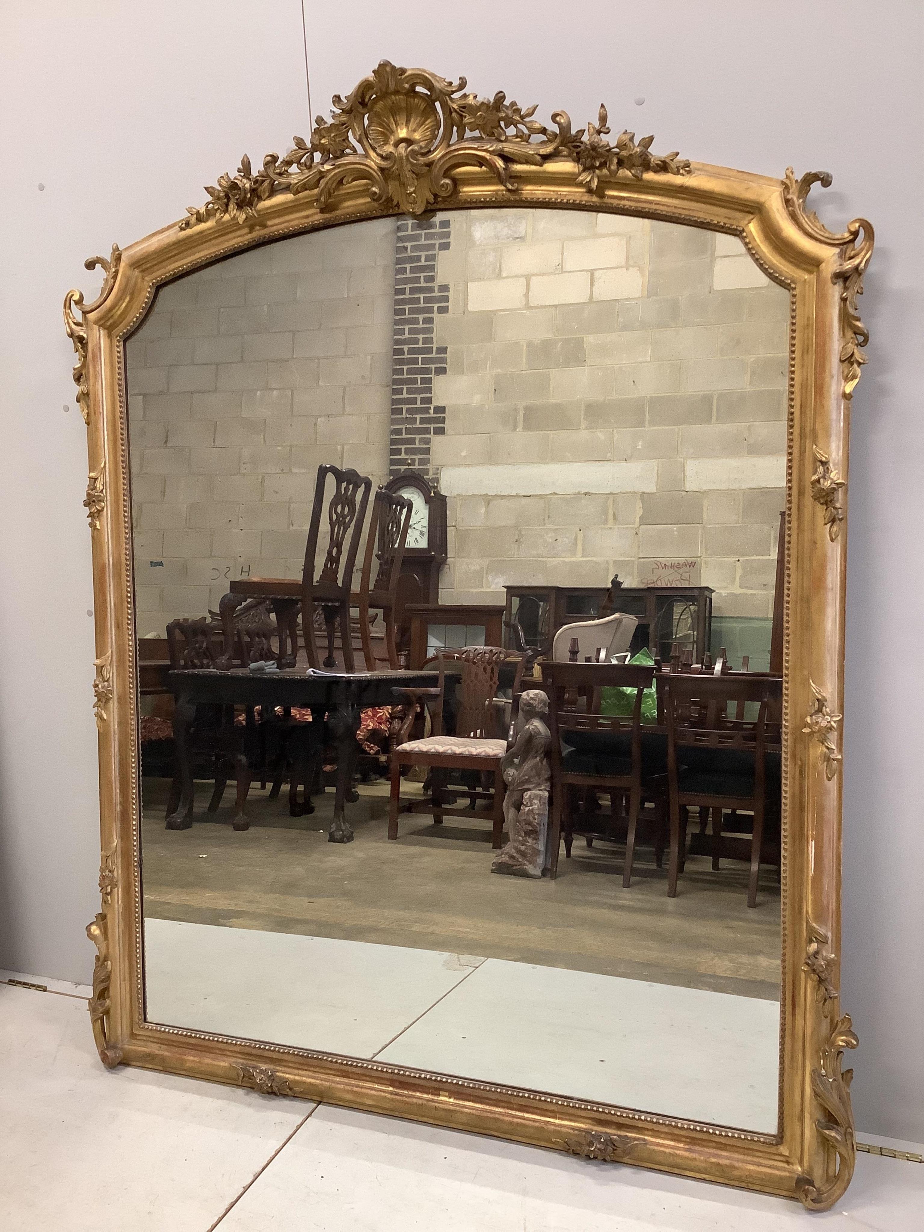 A Victorian giltwood and composition overmantel mirror, width 148cm, height 185cm. Condition - fair to good                                                                                                                 