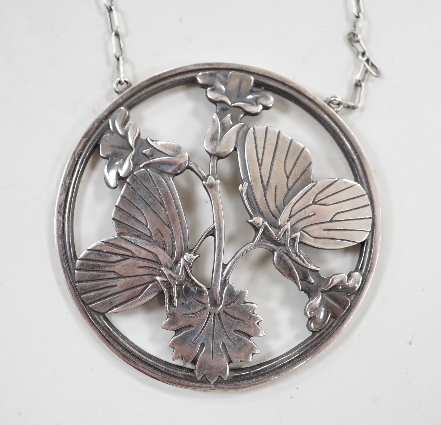 A George Jensen sterling 'Moonlight Blossom' pendant necklace, designed by Arno Malinowski, design no. 105, pendant 50mm.                                                                                                   