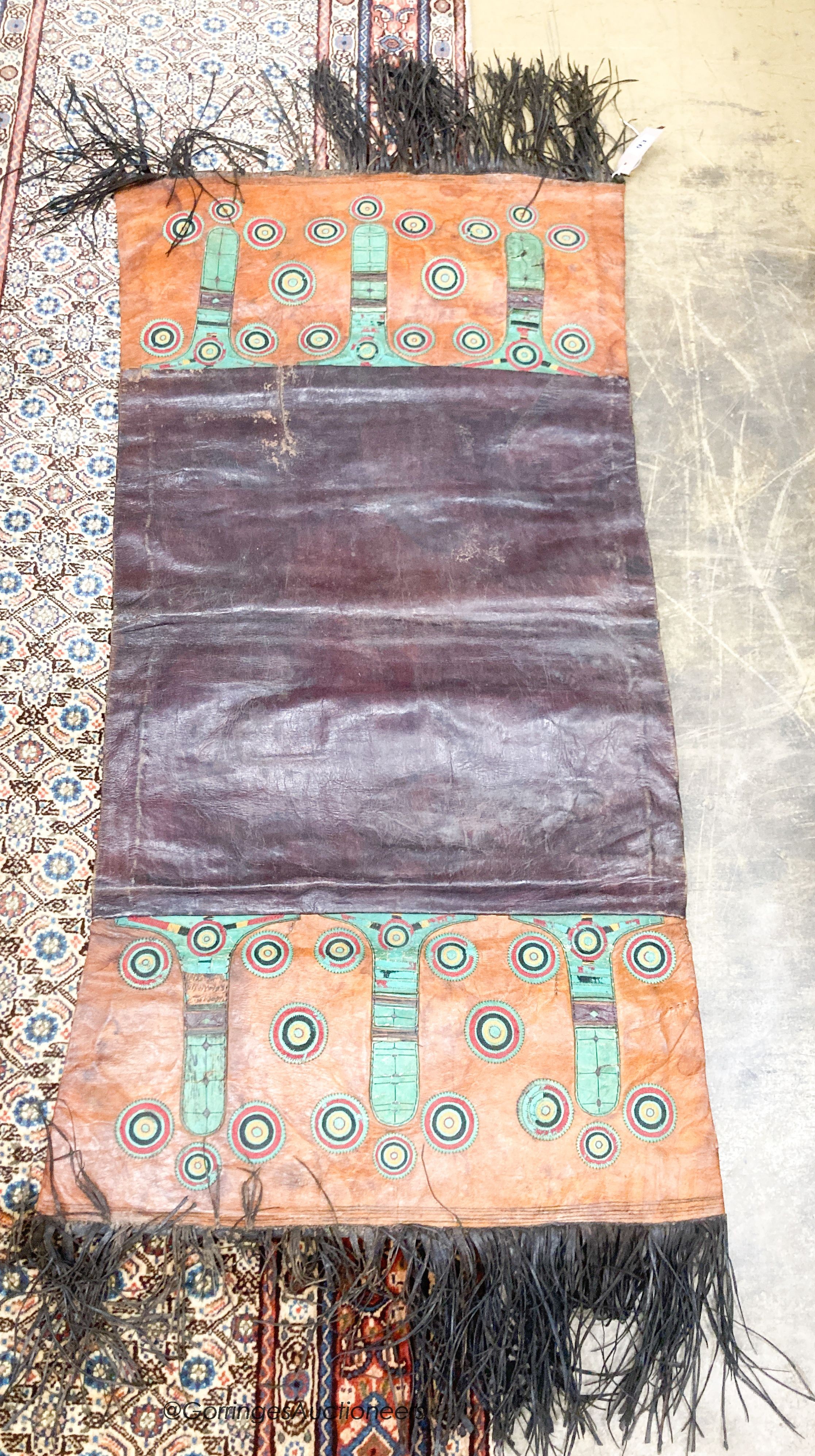 An African tribal mat, 128 x 62cm                                                                                                                                                                                           