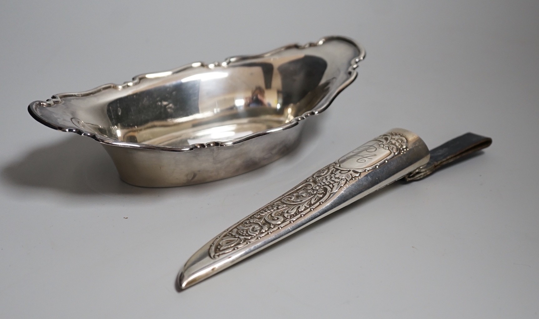 A George V silver bon bon dish, Sheffield, 1928, 19.9cm and a Scandinavian? 925 S white metal mounted dagger sheath, maker EIK.                                                                                             