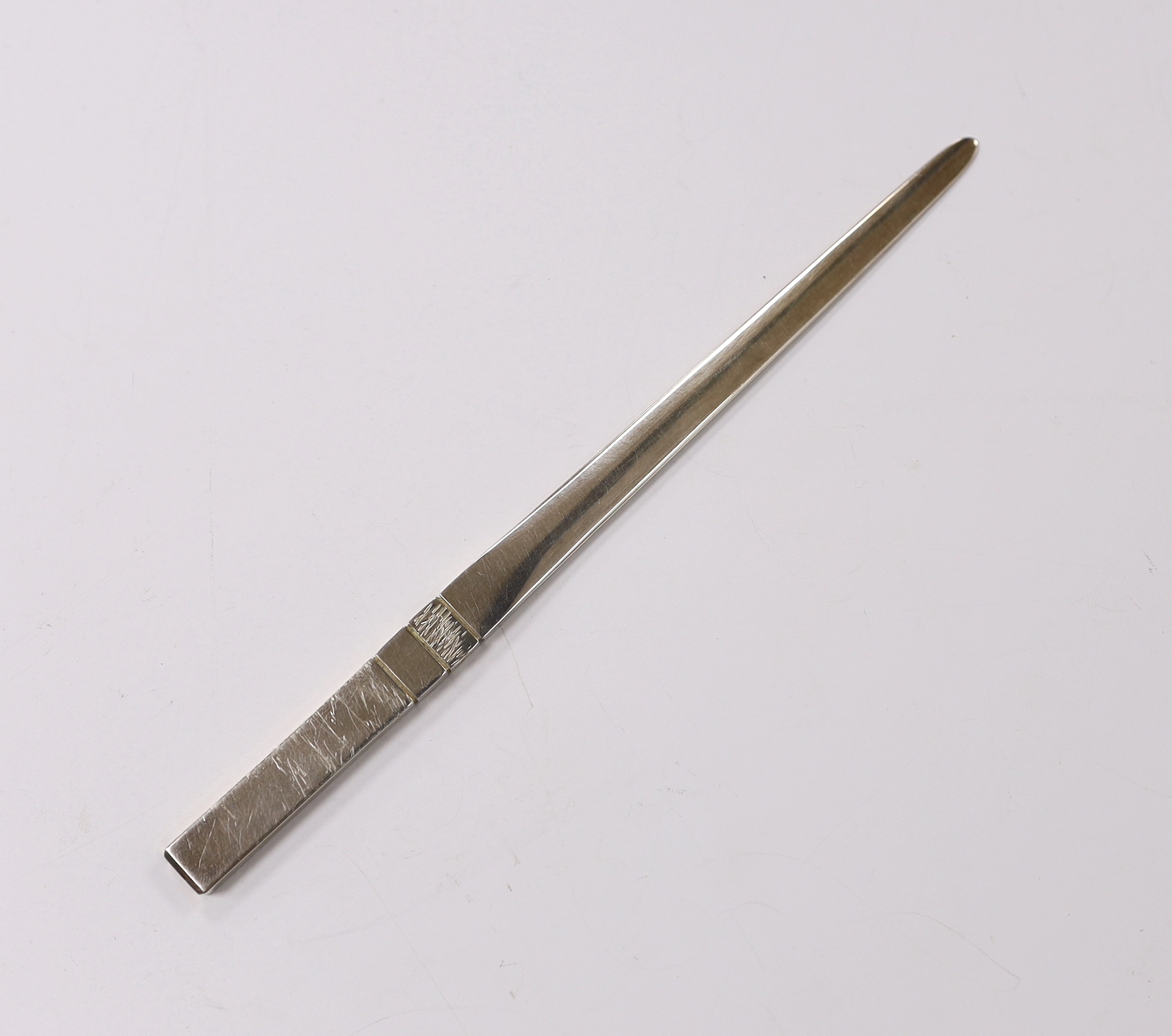 An Elizabeth II part textured silver paper knife, by Pruden & Smith, Sheffield, 2005, 18.4cm, 46 grams, with original box.                                                                                                  