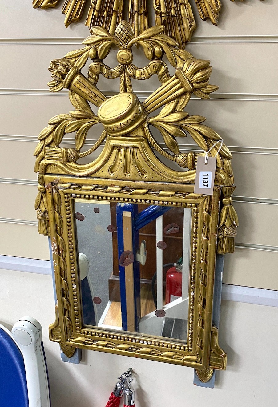 A Continental carved giltwood wall mirror, width 44cm, height 80cm                                                                                                                                                          