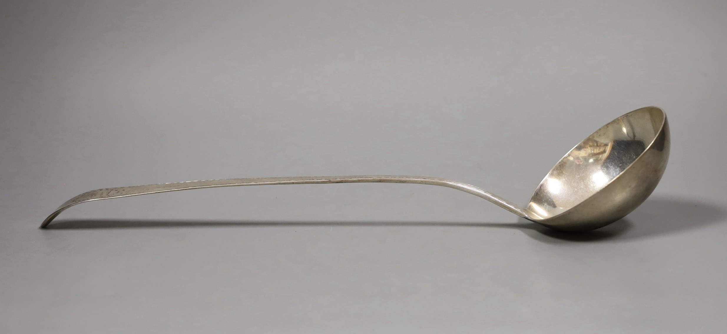 A George III Irish silver soup ladle, with bright cut and crested handle, Dublin 1809, 5.5oz                                                                                                                                
