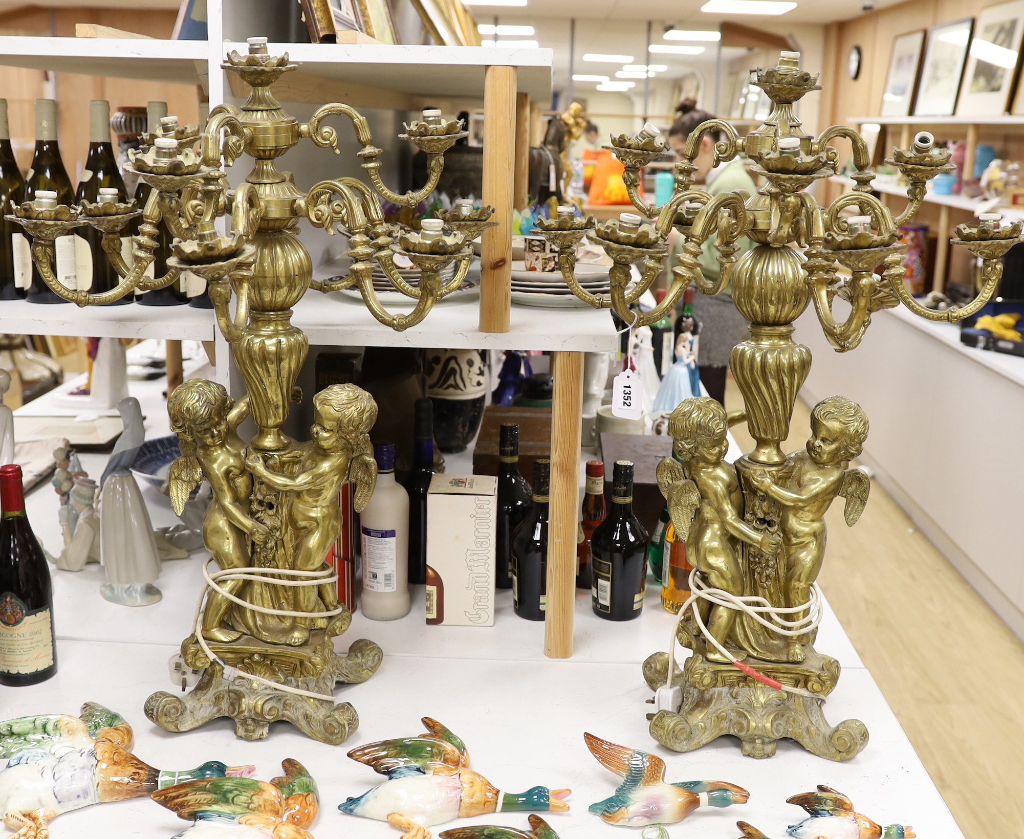 A pair of heavy brass candelabra, 85cm total height                                                                                                                                                                         