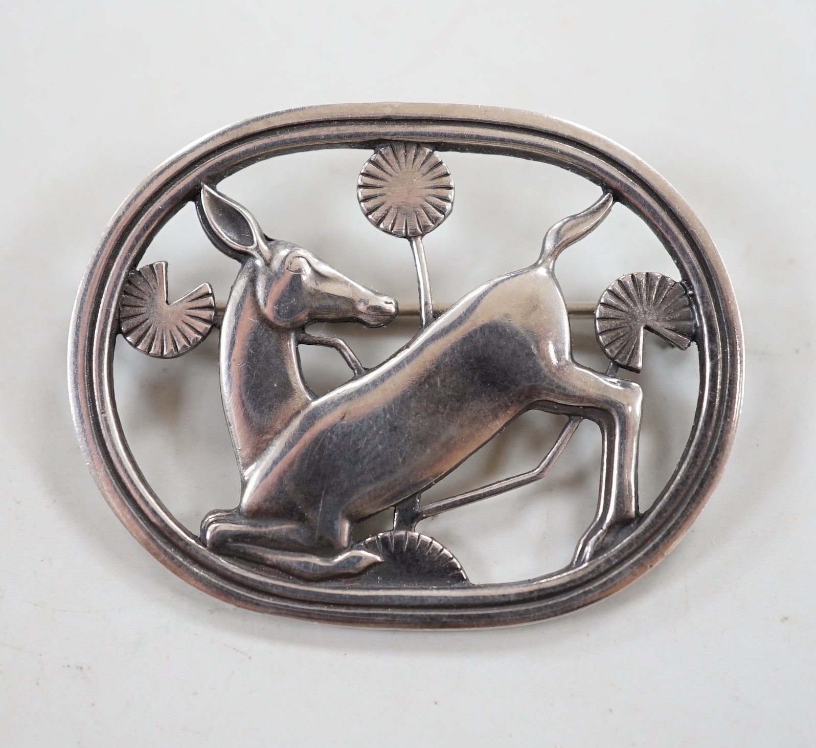 A Georg Jensen sterling oval 'Kneeling deer' brooch, design no. 256, 42mm.                                                                                                                                                  