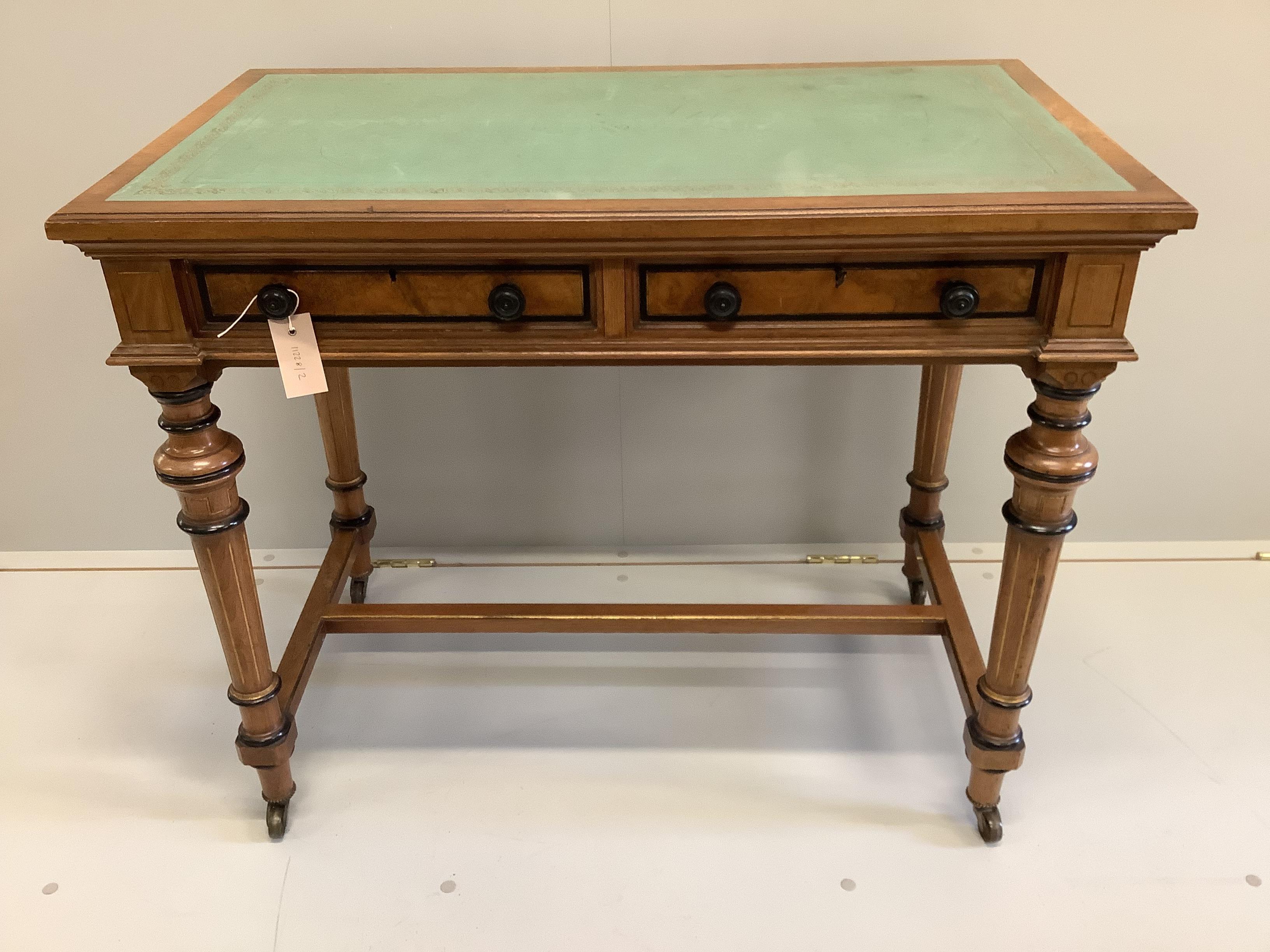 A Victorian Gillows walnut and part ebonised two drawer writing table, width 91cm, depth 53cm, height 75cm                                                                                                                  