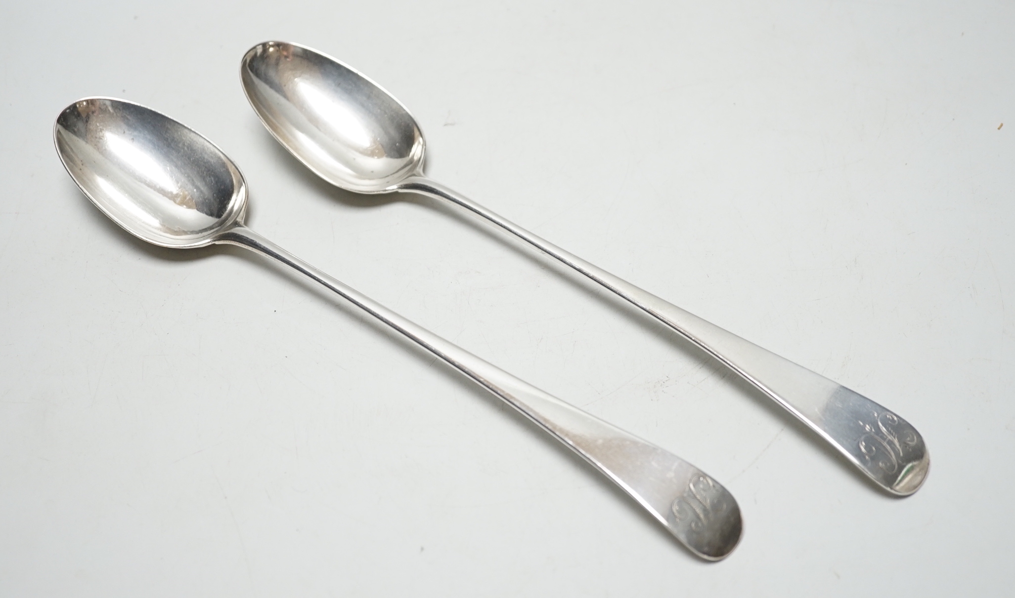 A pair of George III Old English pattern base marked basting spoons, London 1771?, 30cm, 7oz.                                                                                                                               