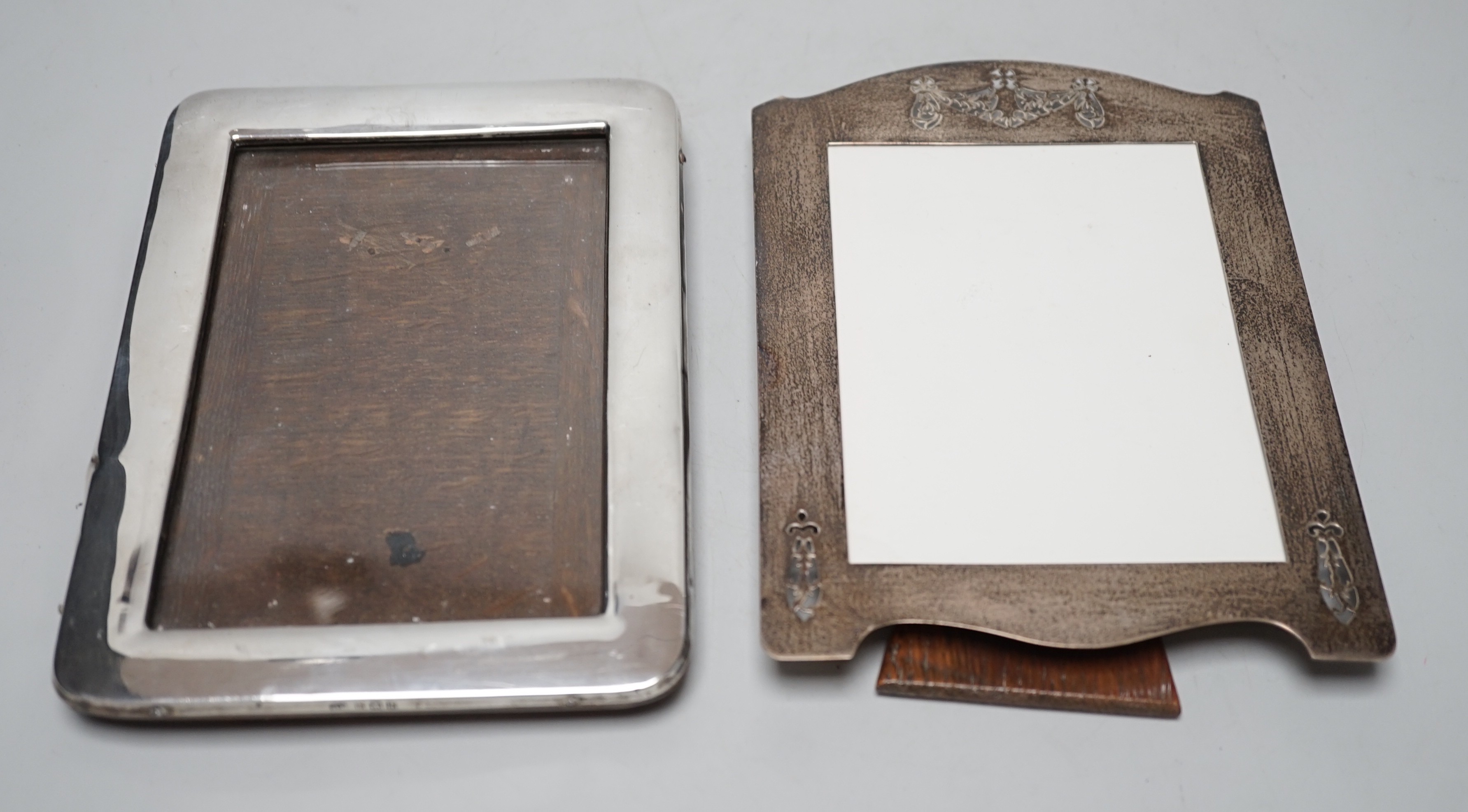 A George V pierced silver mounted photograph frame, W & F Rabone, Birmingham, 1912, 19cm and one other Edwardian silver mounted photograph frame.                                                                           