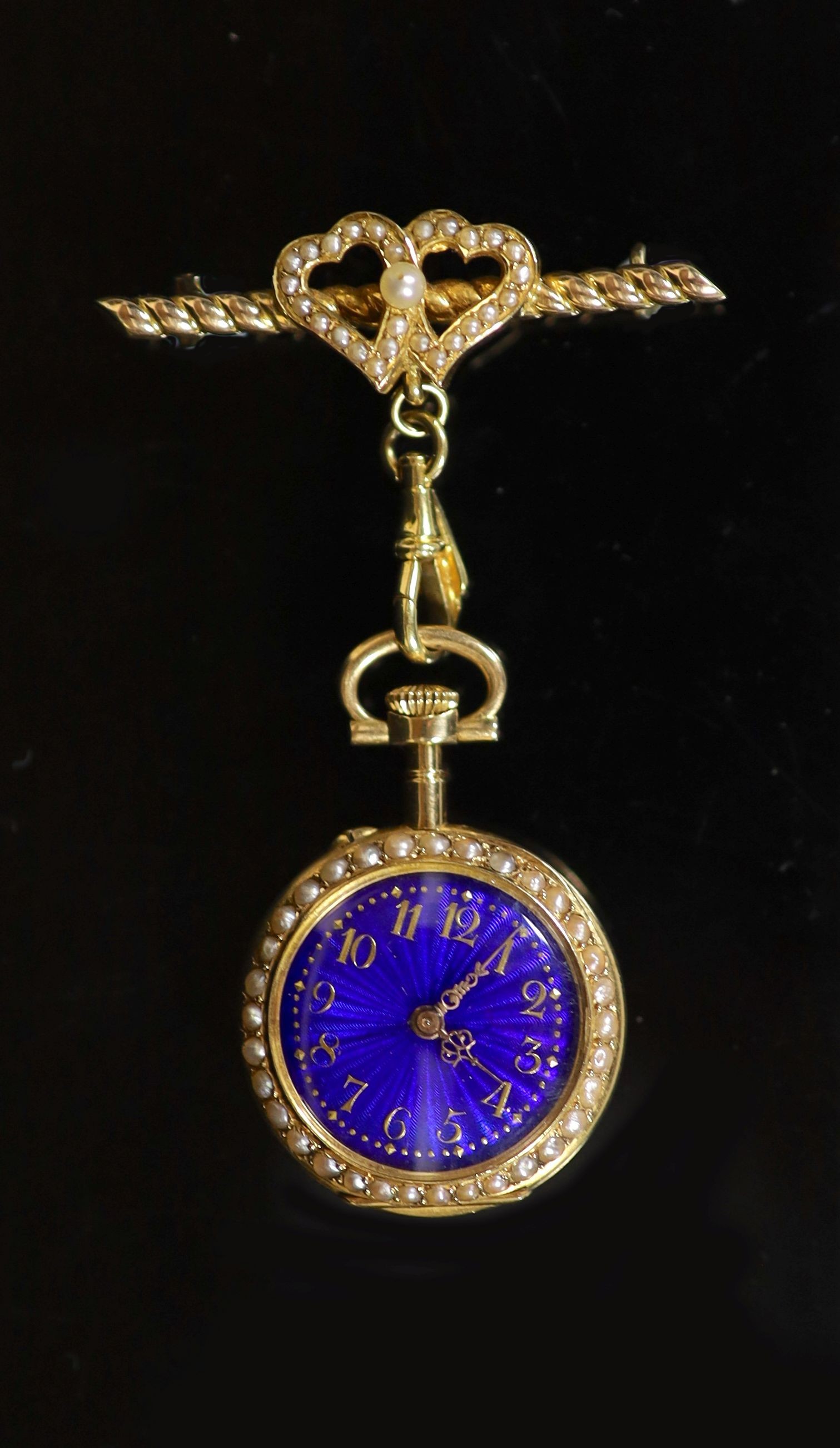 An early 20th century Swiss enamelled keyless 18ct gold fob watch, watch 3.75cm.                                                                                                                                            