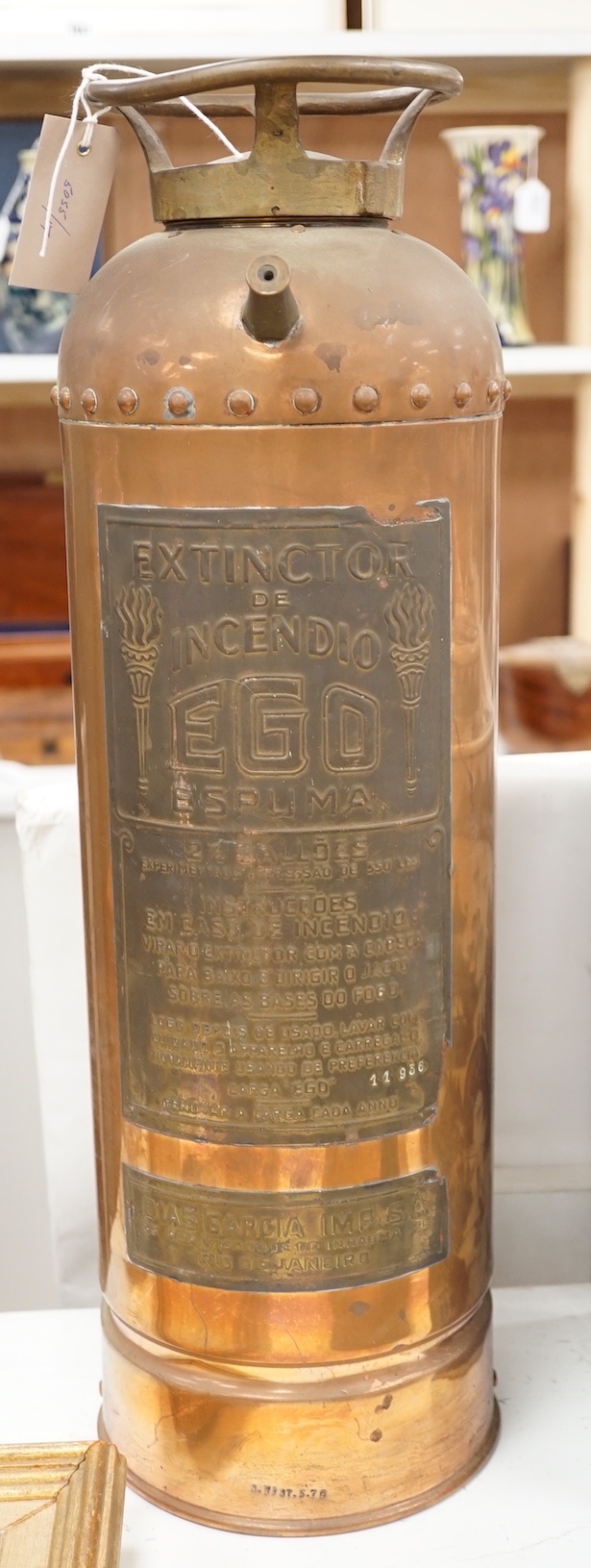 A Spanish copper fire extinguisher, 60cm                                                                                                                                                                                    