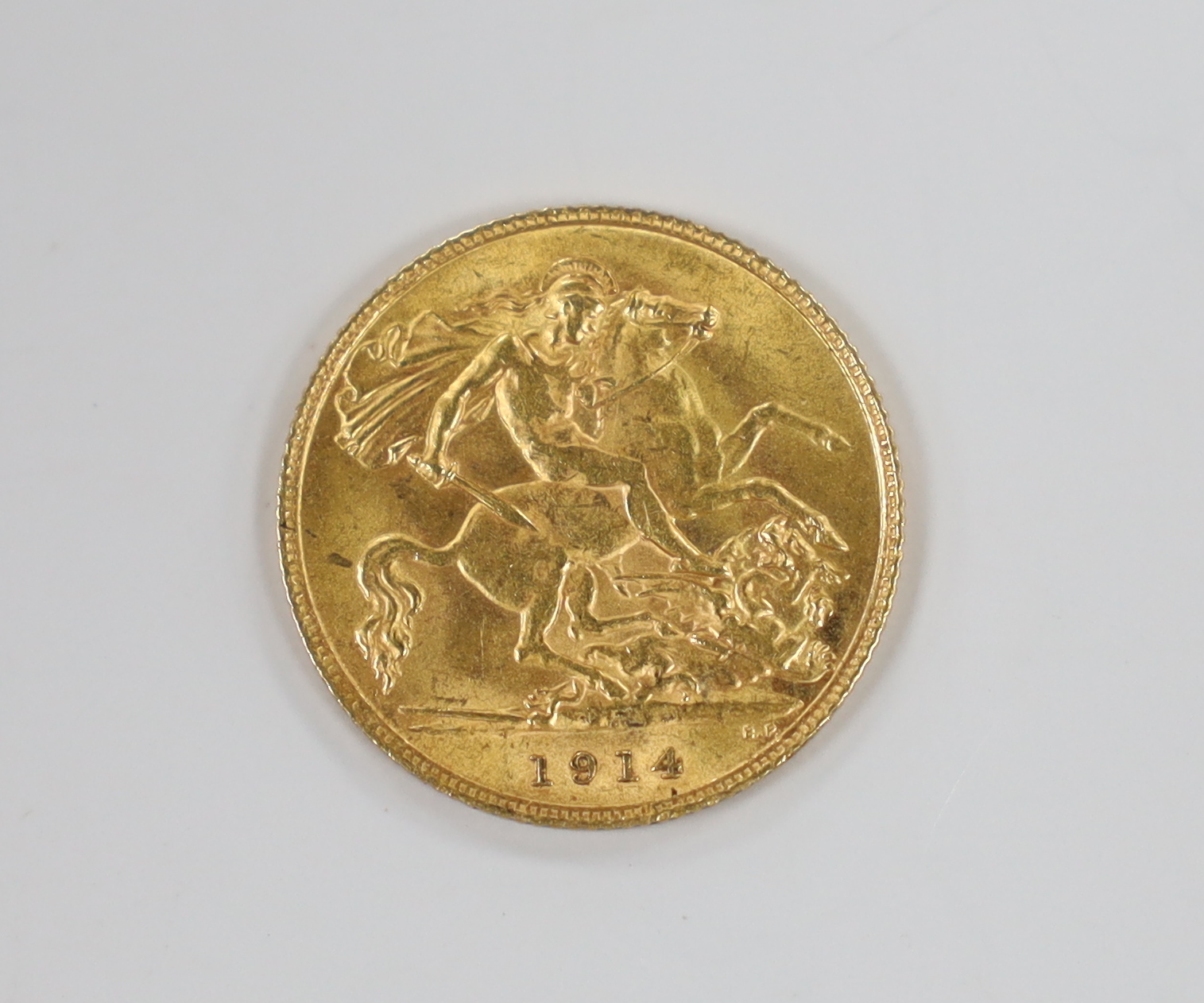 A George V 1914 gold half sovereign.                                                                                                                                                                                        