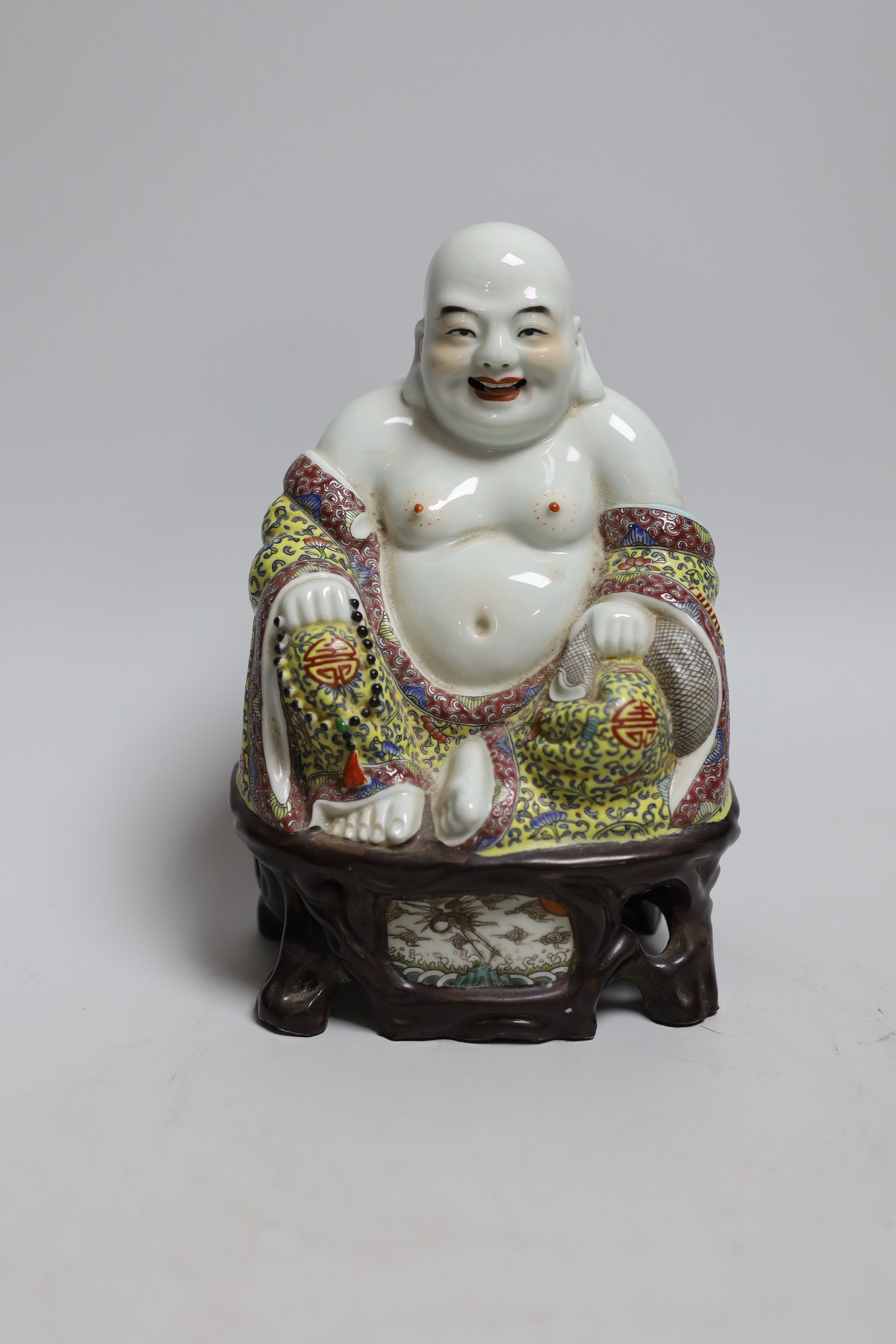 A Chinese enamelled porcelain figure of Budai, 20cm high                                                                                                                                                                    