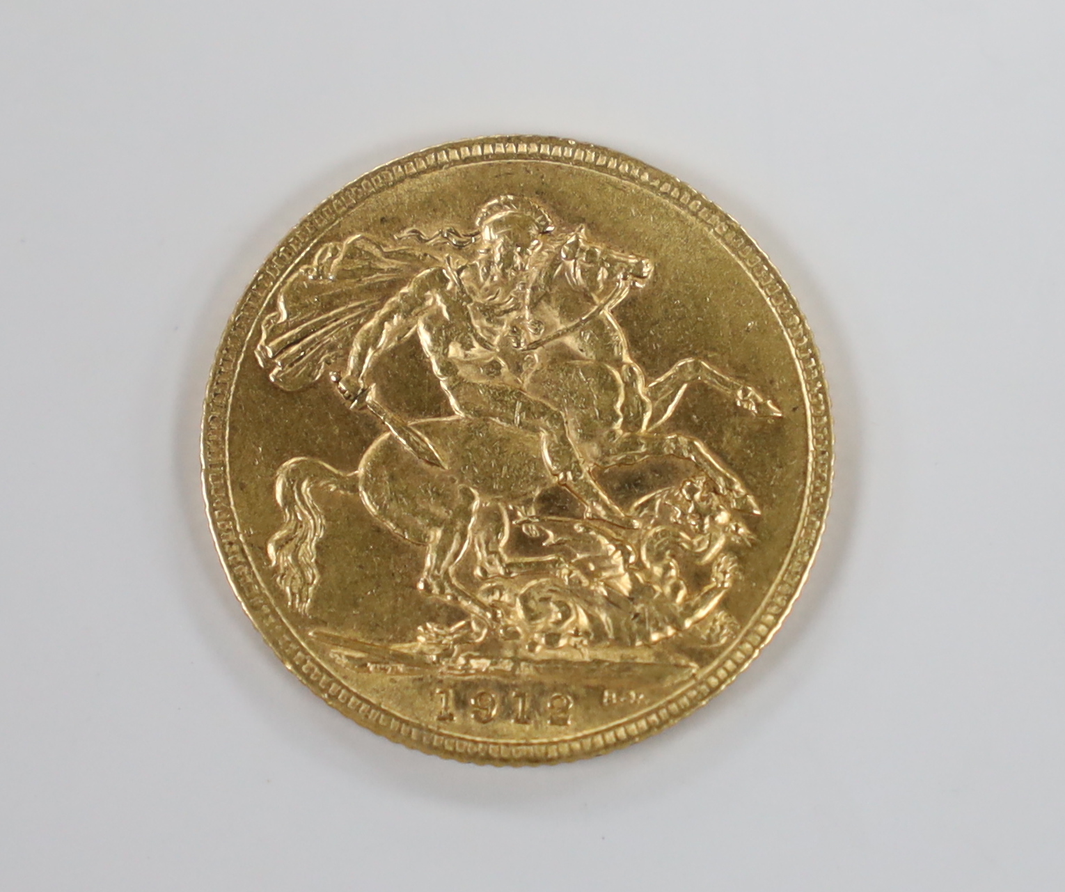 A George V 1912 gold sovereign.                                                                                                                                                                                             