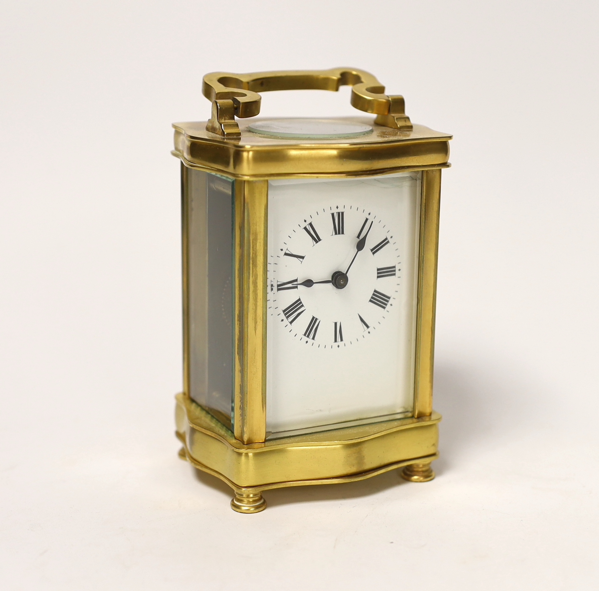 A French gilt metal carriage timepiece, 16cm high                                                                                                                                                                           