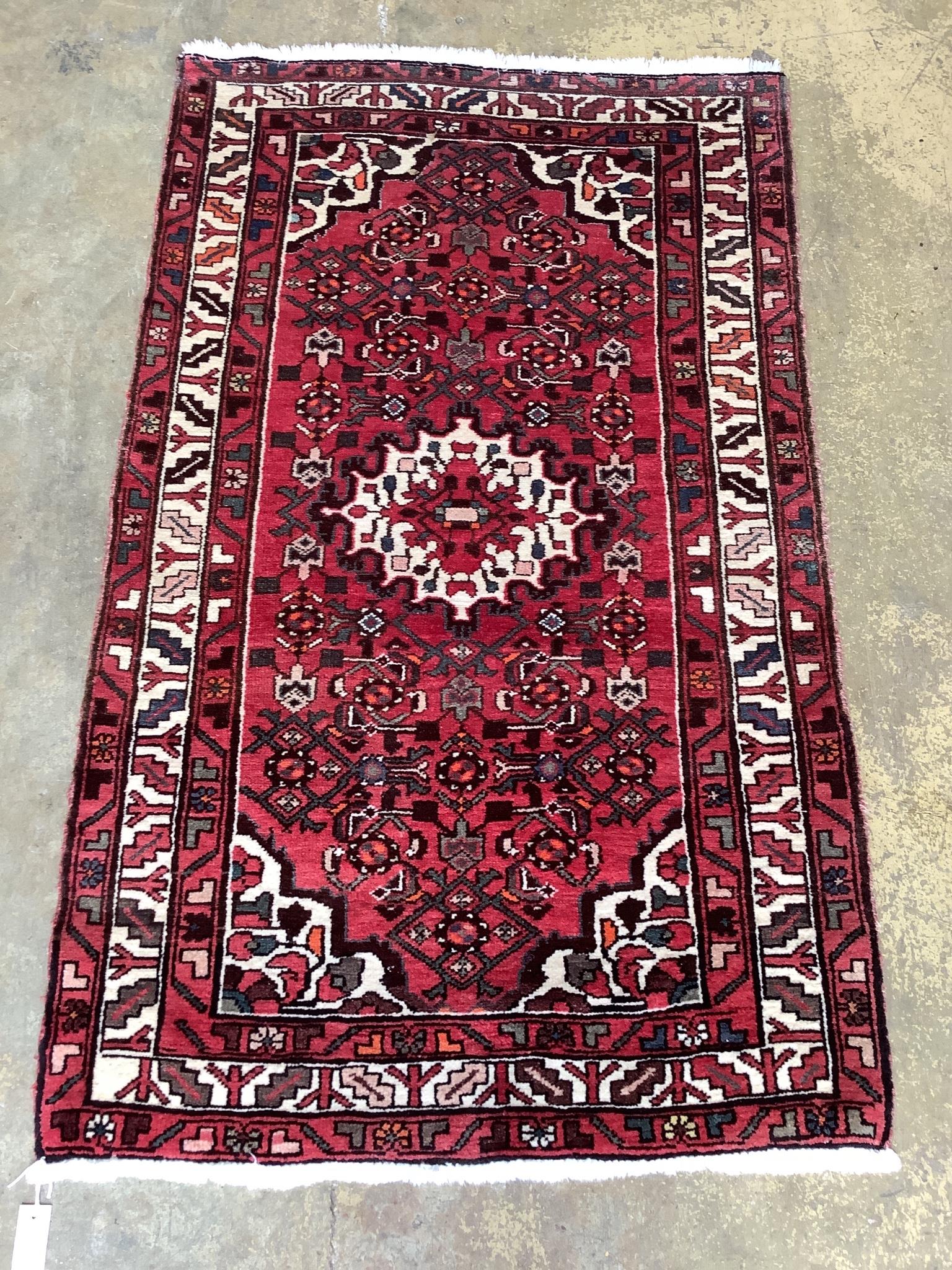 A North West Persian red ground rug, 166 x 100cm                                                                                                                                                                            