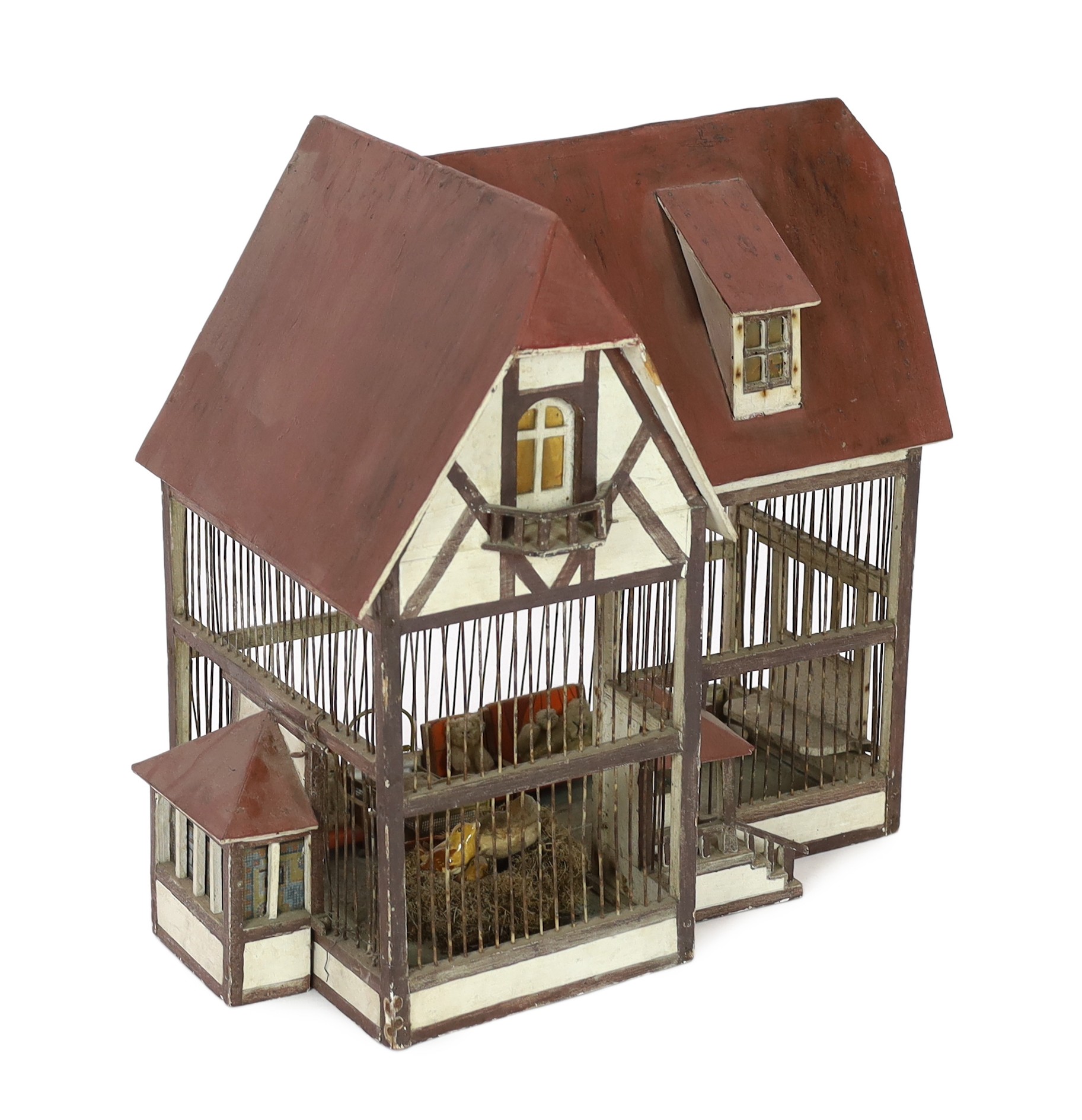 A German ‘birdcage’ dolls’ house, late 19th century, 56cm high                                                                                                                                                              