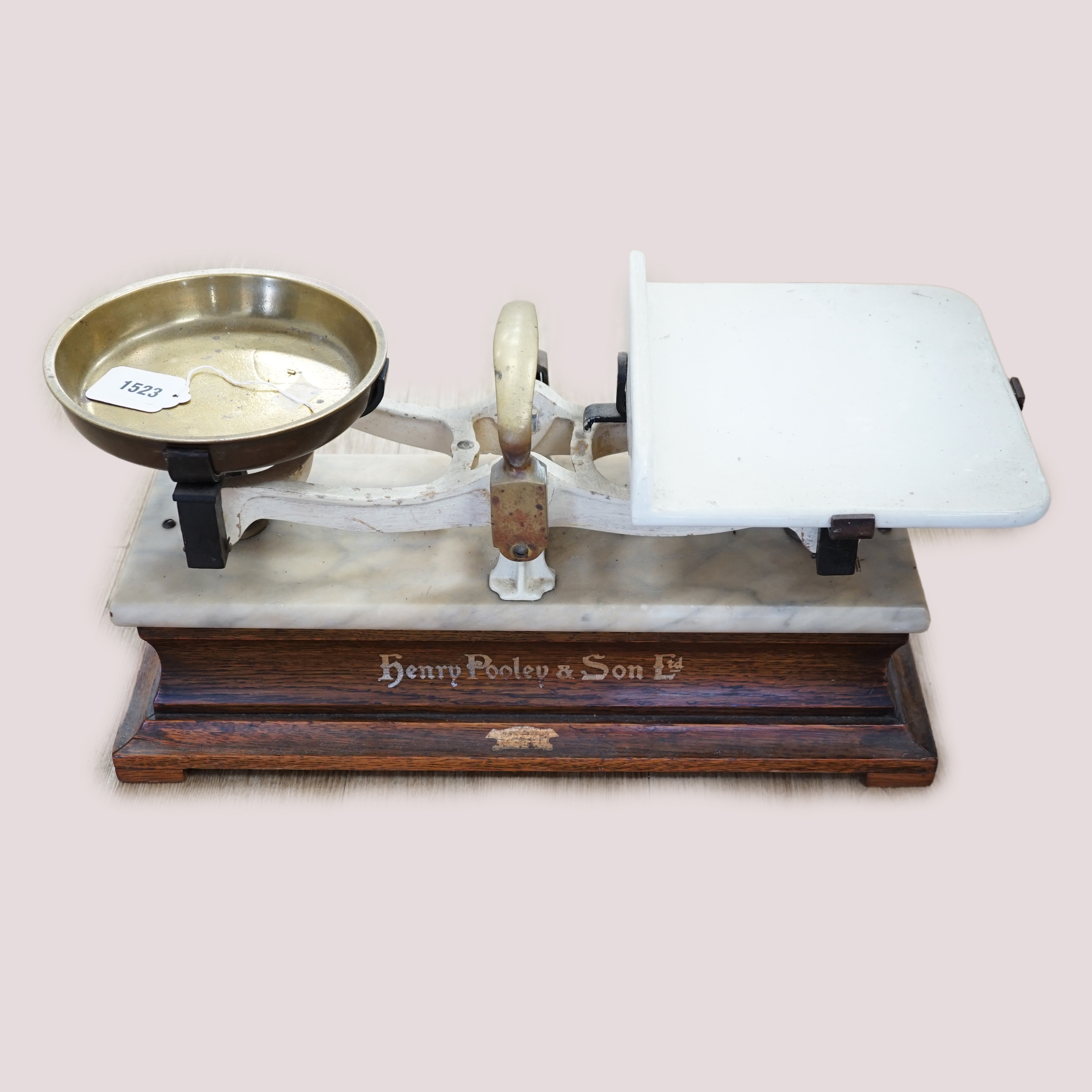 A pair of marble and brass shop counter scales, 53cm wide                                                                                                                                                                   