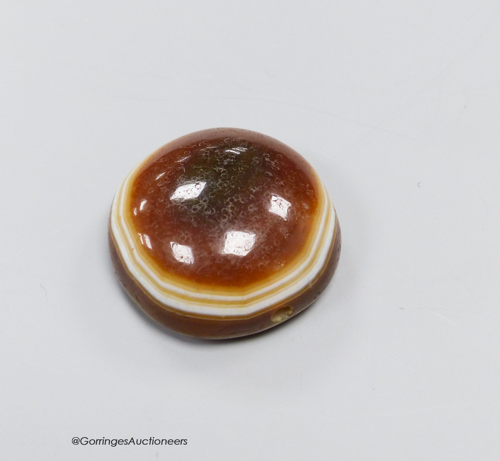 A cased agate pendant                                                                                                                                                                                                       