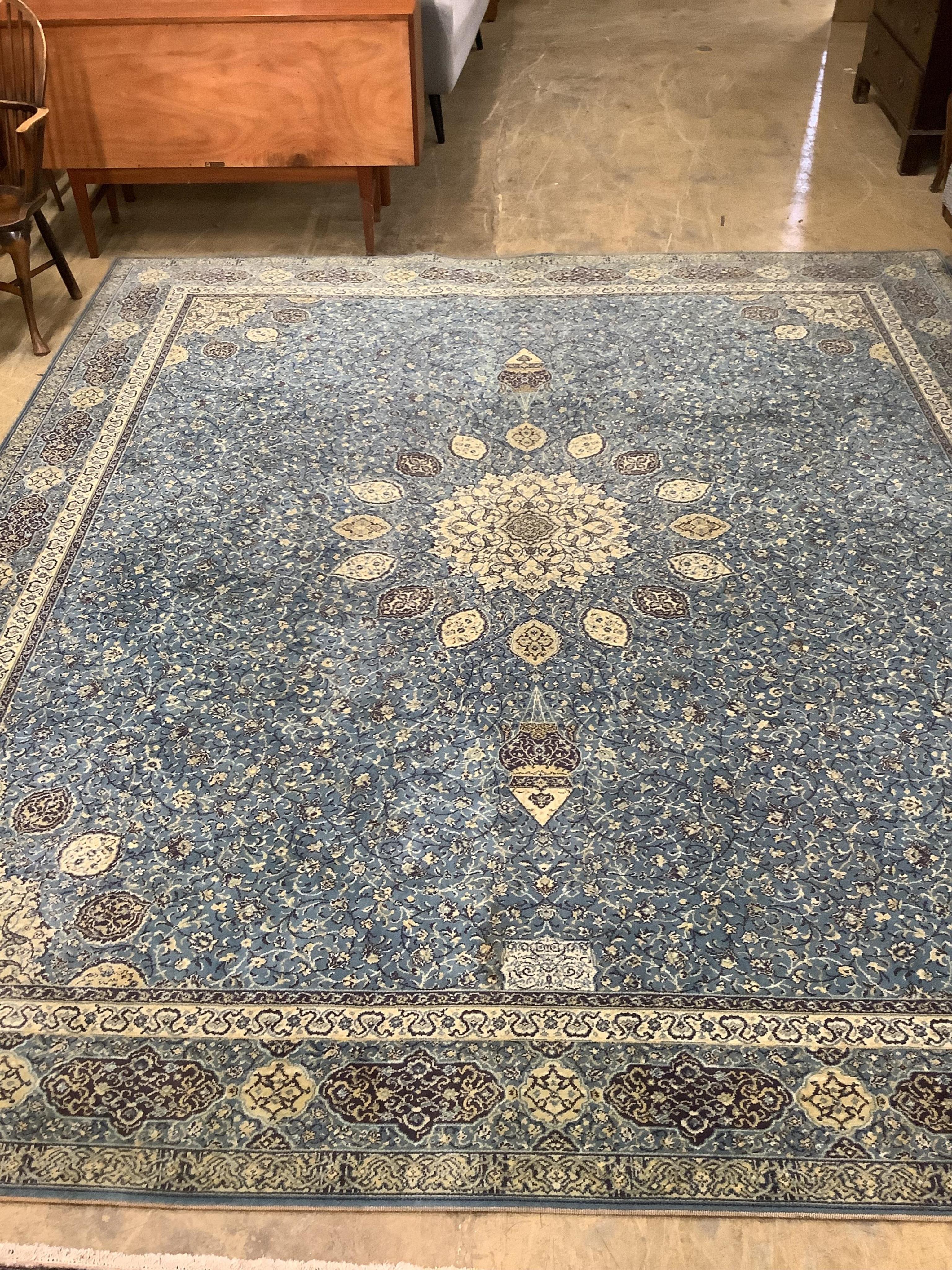 A Wilton Kashmir style machined blue ground carpet, 364 x 320cm. Condition - good                                                                                                                                           