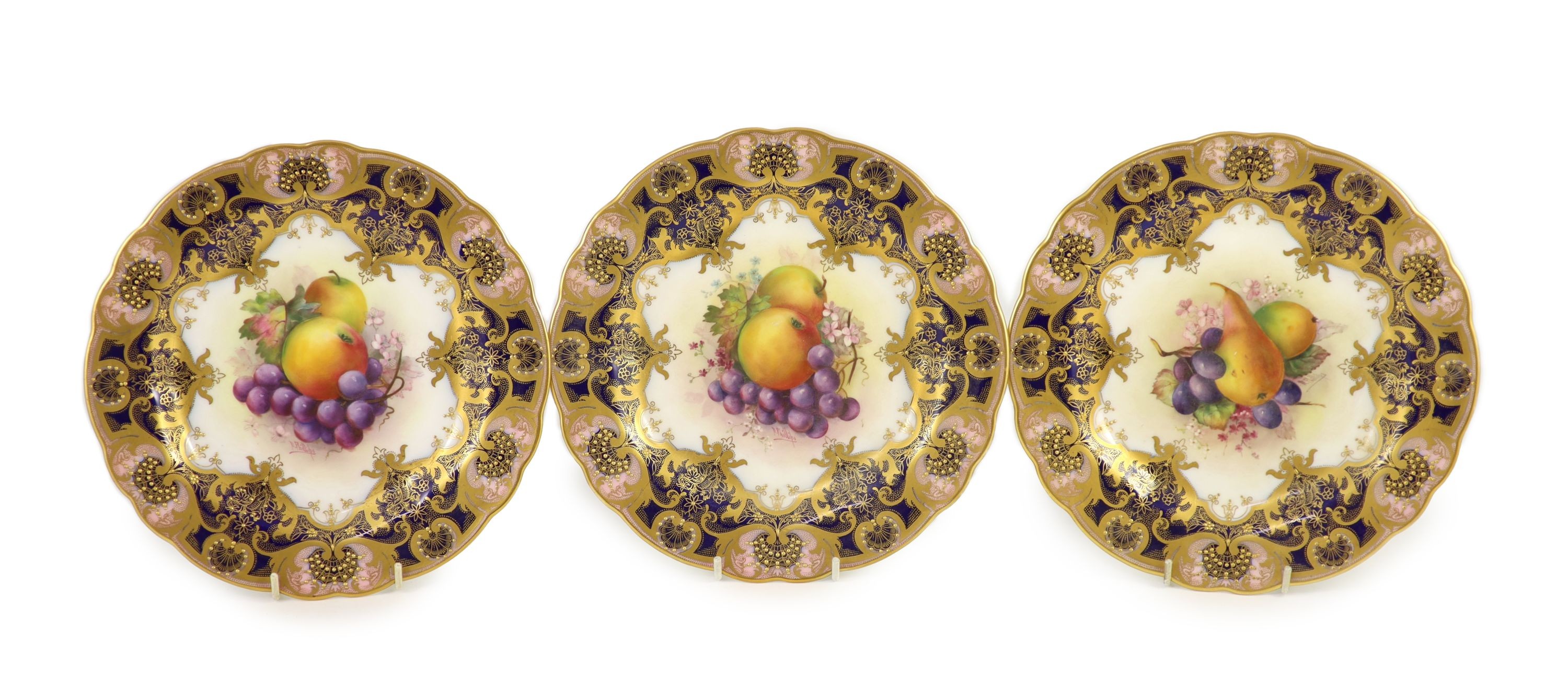 Three Royal Worcester fruit painted dessert plates, signed E. Phillips, c.1918, 22.5cm diameter                                                                                                                             