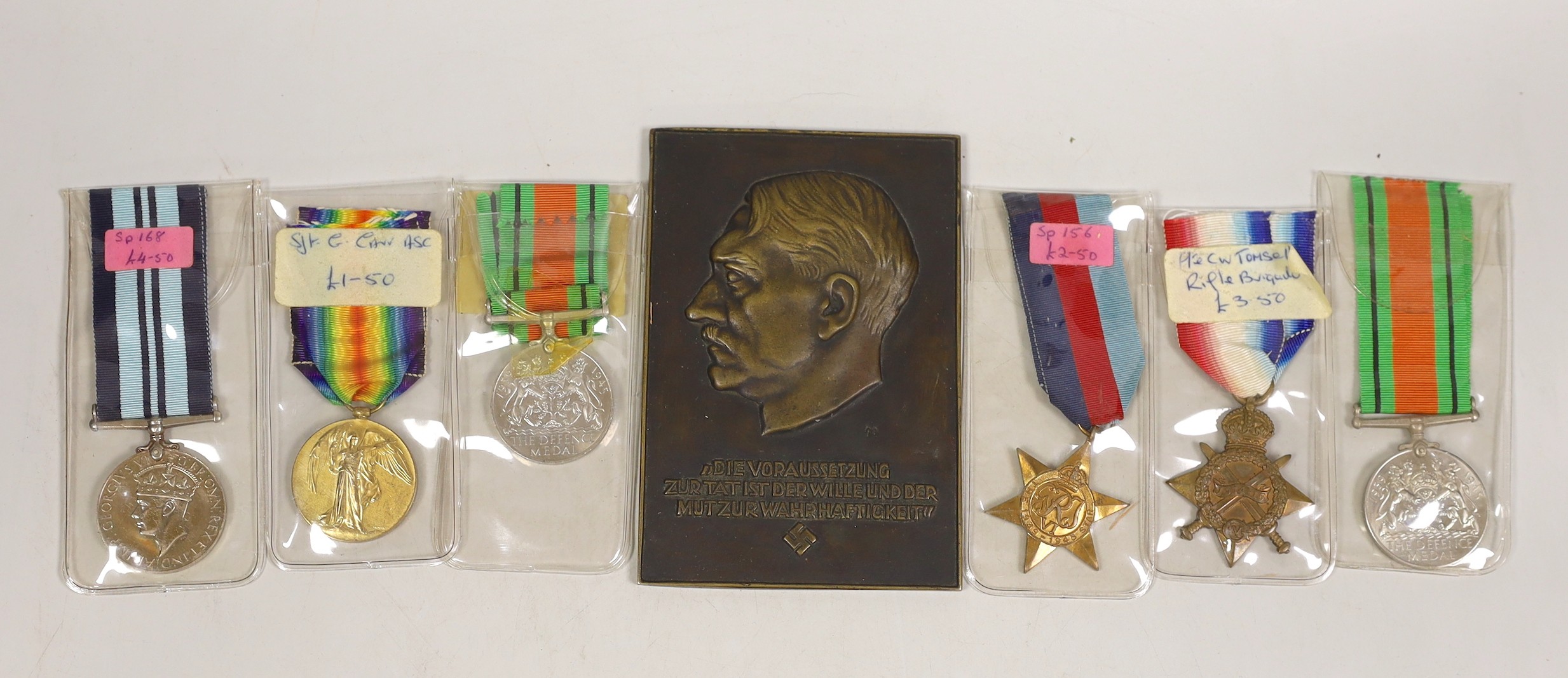 Two WWI medals, other medals and an Adolf Hitler bronze plaque                                                                                                                                                              