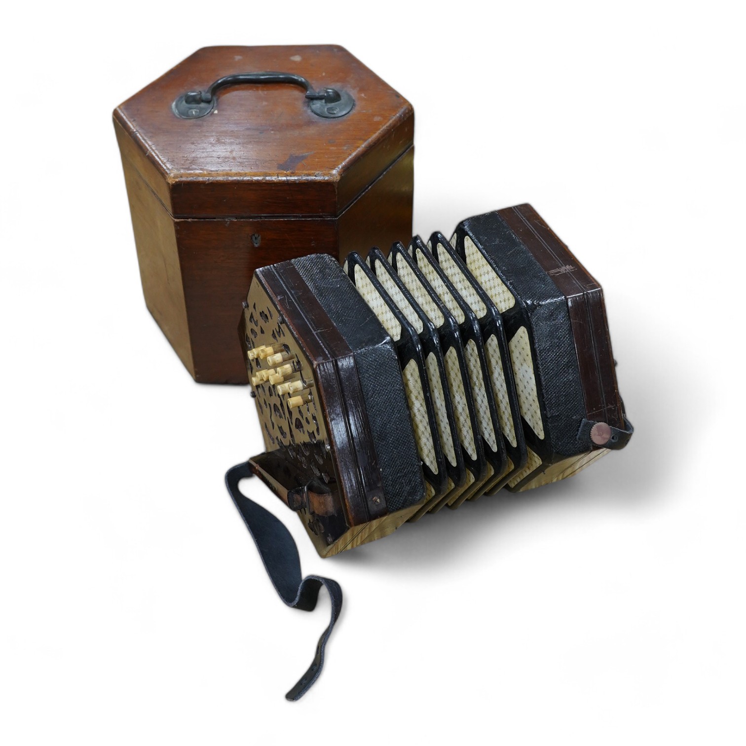 A mid-19th century Lachenal & Co., London mahogany concertina, in an hexagonal mahogany case. Condition - fair to good, the leatherwork on the bellows appears sound and strong.                                            