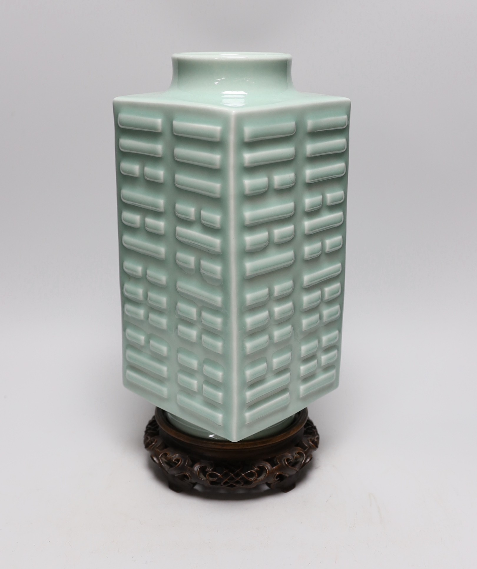 A Chinese celadon glazed eight trigrams cong vase, Guangxu mark, wood stand, 35cms high                                                                                                                                     