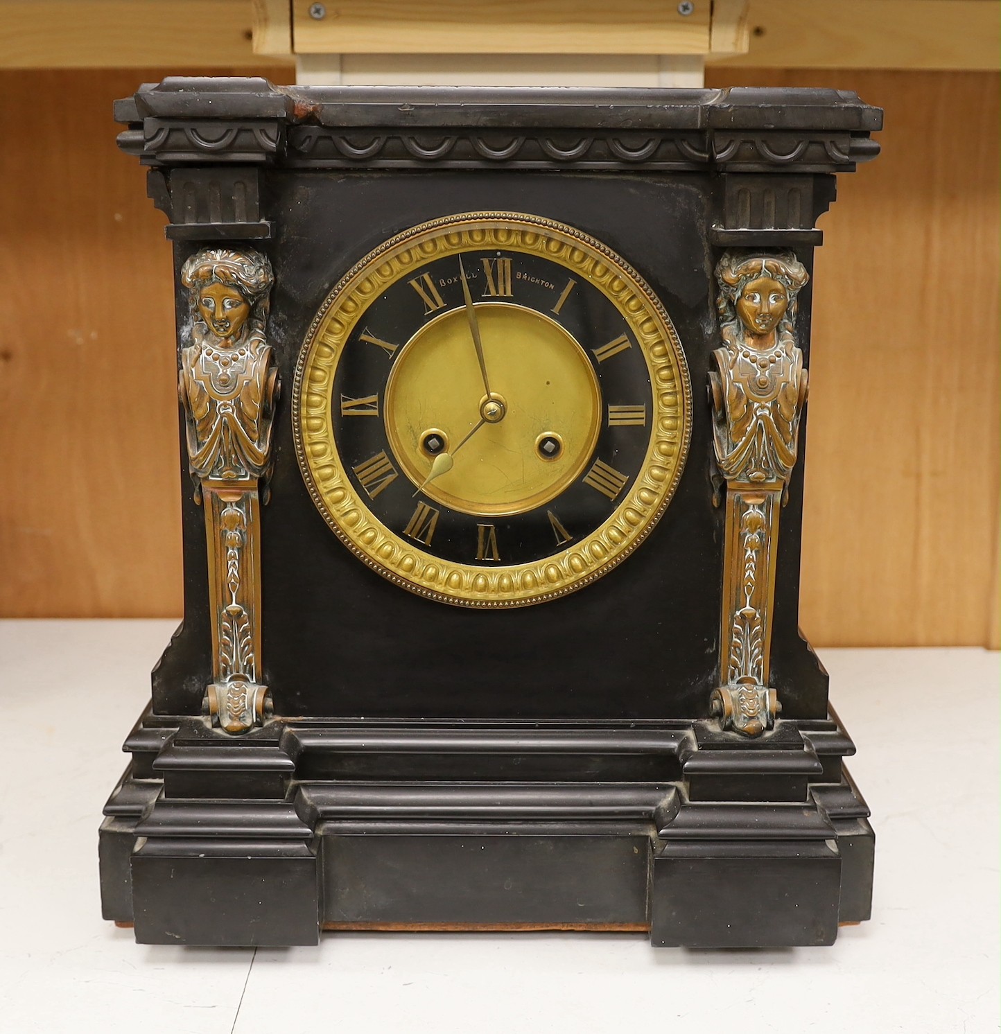 A large Victorian Broxell Brighton, black slate mantel clock with bronze figural mounts, 40cms high x 36cms wide                                                                                                            