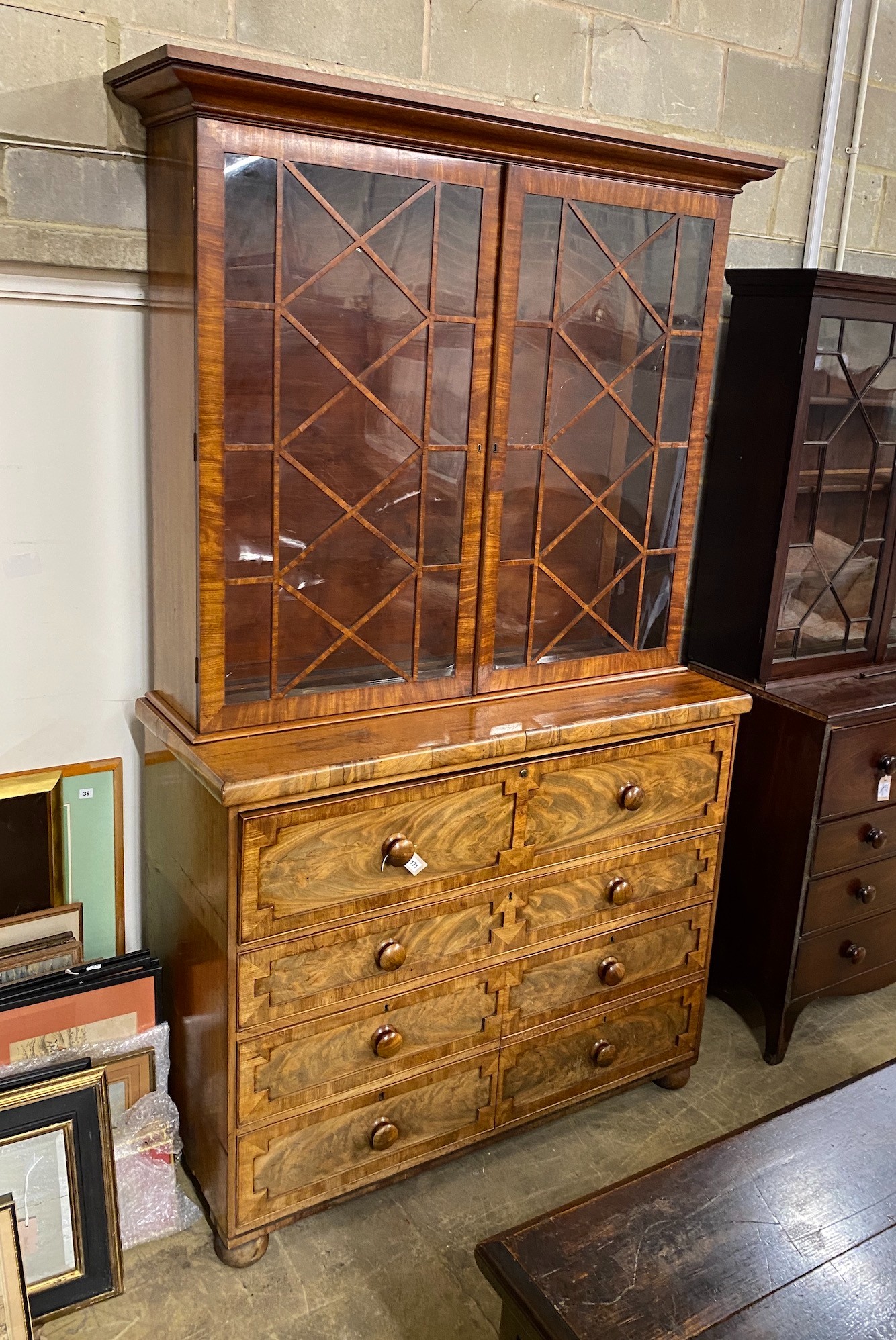 A George IV pale mahogany secretaire bookcase, width 138cm, depth 54cm, height 242cm                                                                                                                                        