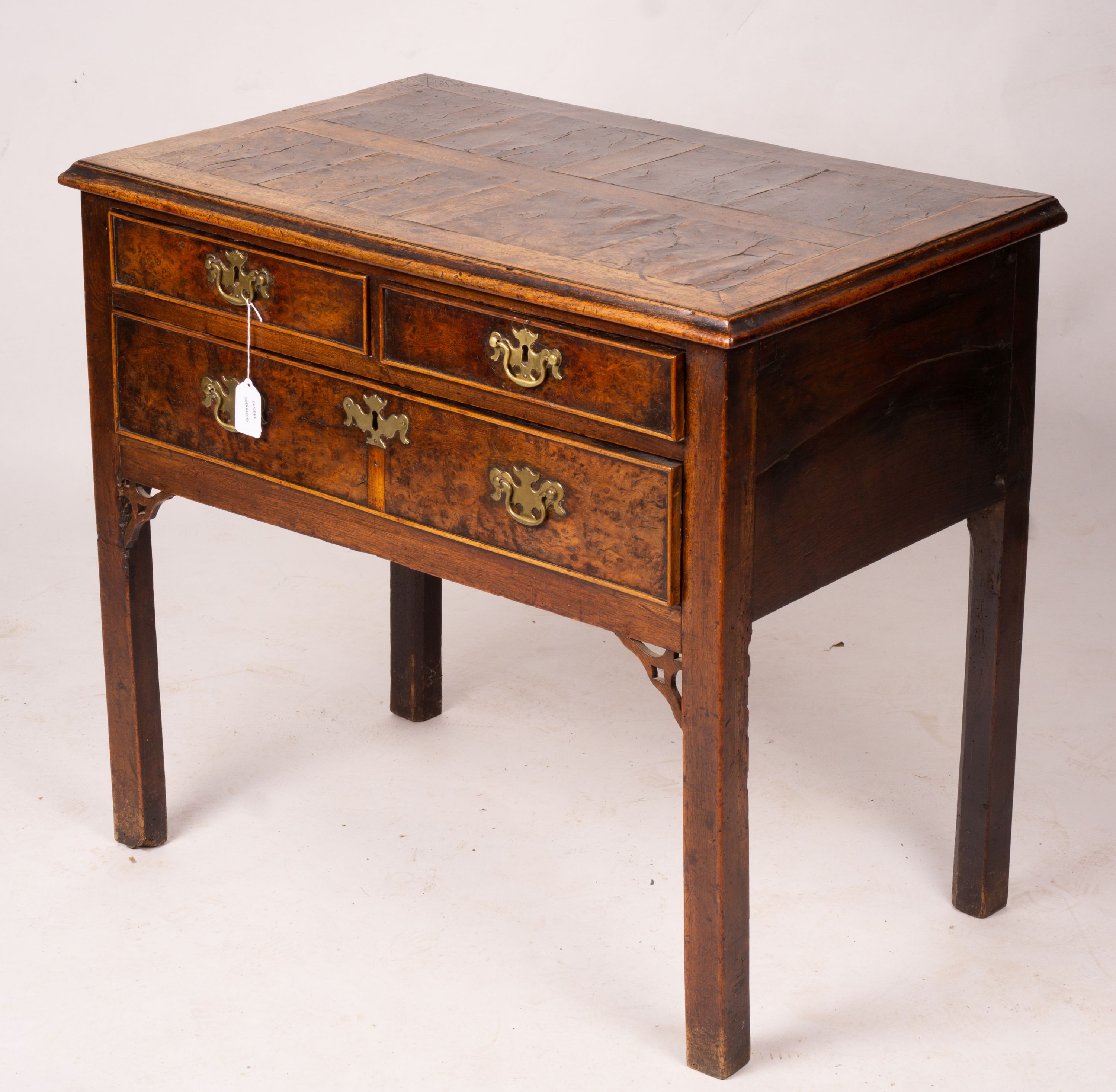 A George III oak and pollard oak three drawer side table, width 83cm, depth 51cm, height 72cm                                                                                                                               