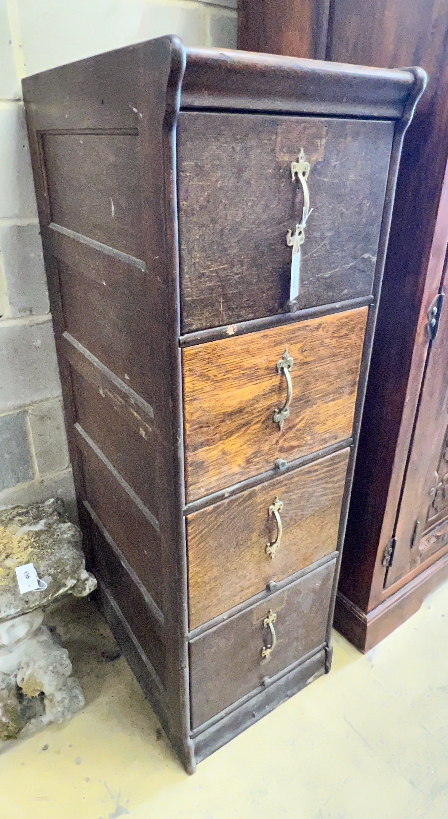 An early 20th century oak four drawer filing cabinet, width 45cm, depth 64cm, height 141cm                                                                                                                                  
