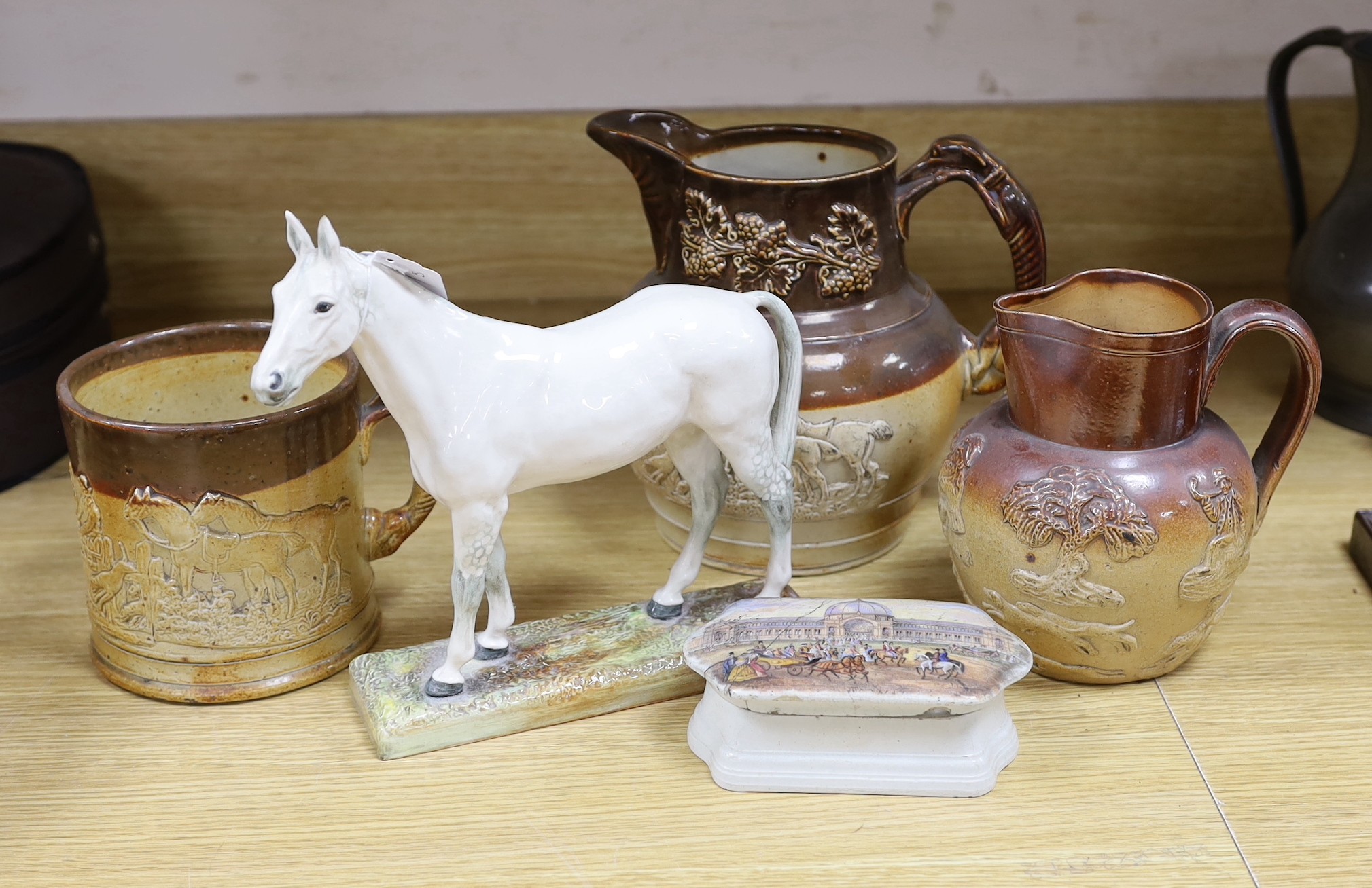 A Royal Doulton figure of a grey horse, HN2538, two stoneware jugs and a similar mug and a pot lid and base, horse 23cms high                                                                                               