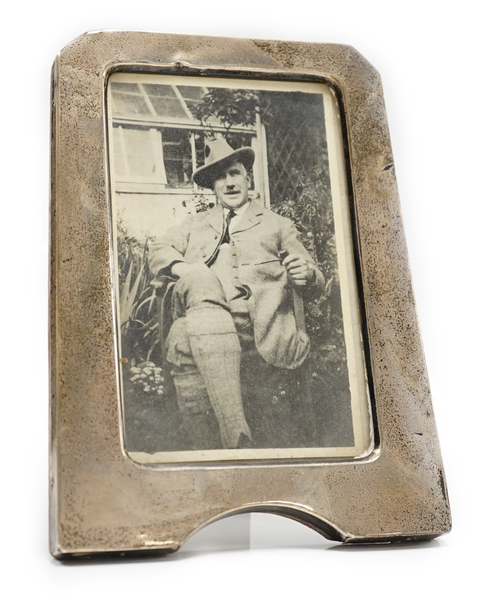 A George V silver photograph frame, Birmingham, 1919, 17.8cm.                                                                                                                                                               