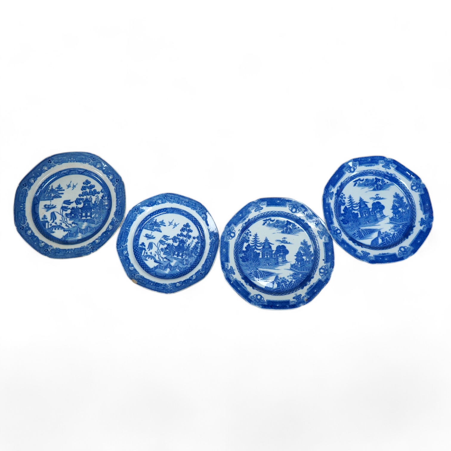 Four early 19th century English pearlware blue and white plates, largest 23.5cm. Condition - fair                                                                                                                           