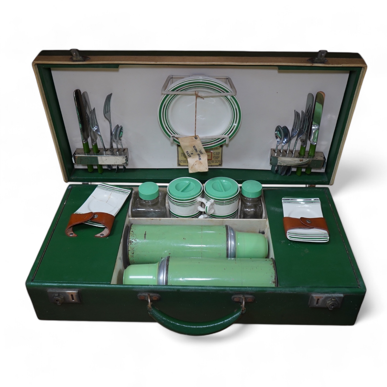 An Art Deco, c.1930's cased picnic set with flasks, cutlery, plates and cups. Condition - poor                                                                                                                              