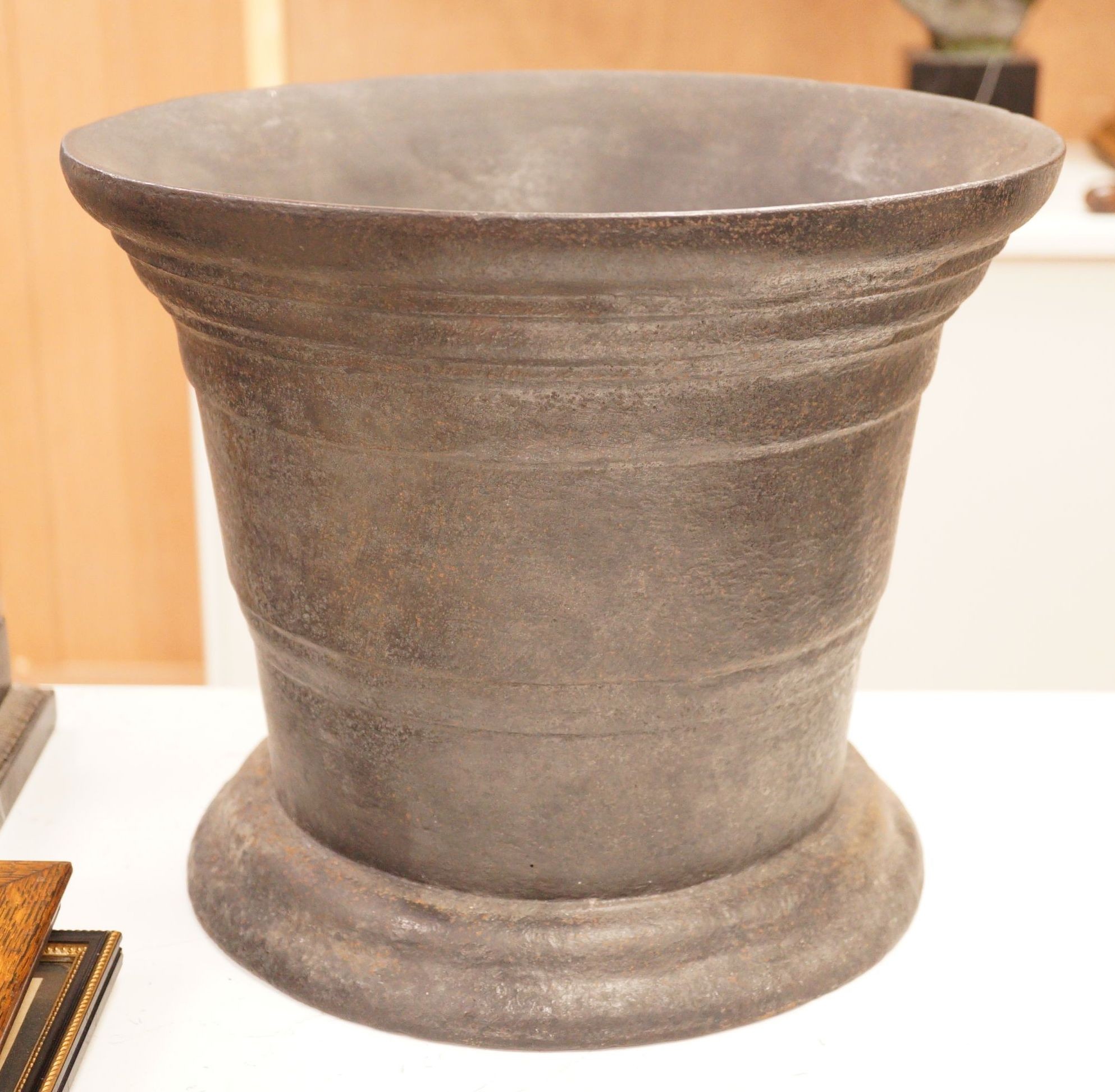 A very large and heavy cast iron mortar, 29cm tall                                                                                                                                                                          