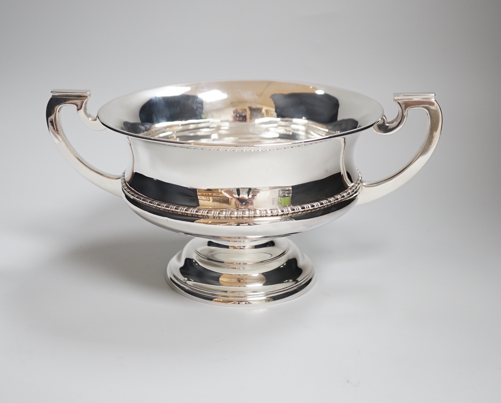 A George V two handled silver bowl, with pedestal foot and beaded rim, makers Elkington & Co., Birmingham 1945, 698 grams                                                                                                   