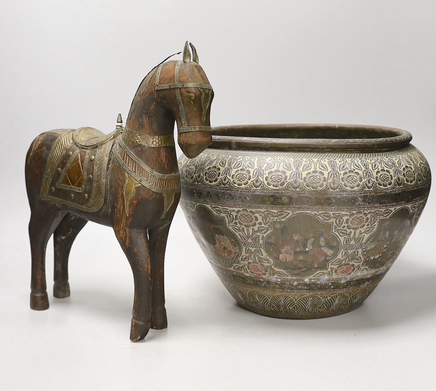 An Indian engraved brass jardiniere and brass-mounted wood horse, 31cm tall                                                                                                                                                 