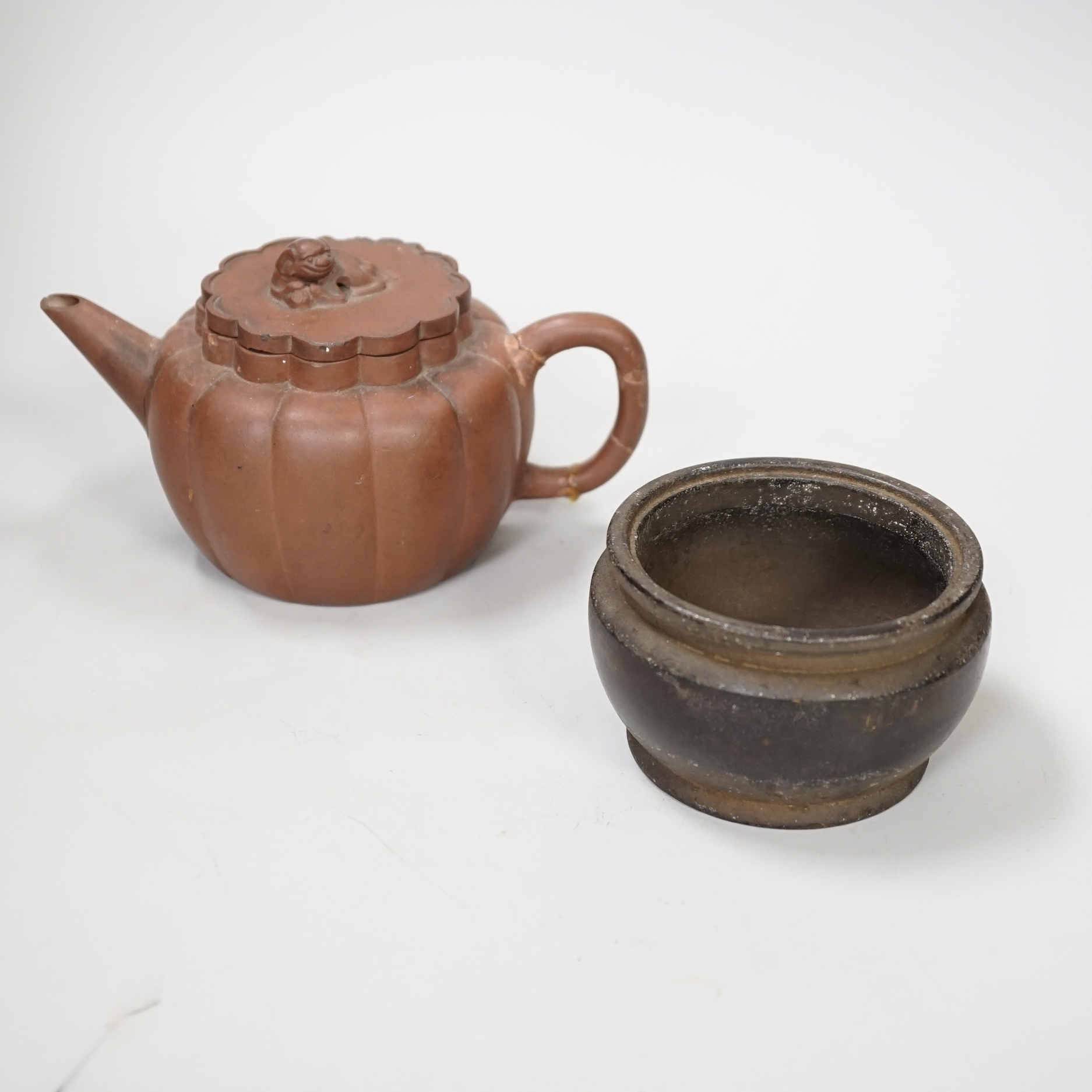 A Chinese Yixing teapot and a bronze censer, teapot 10 cm high                                                                                                                                                              