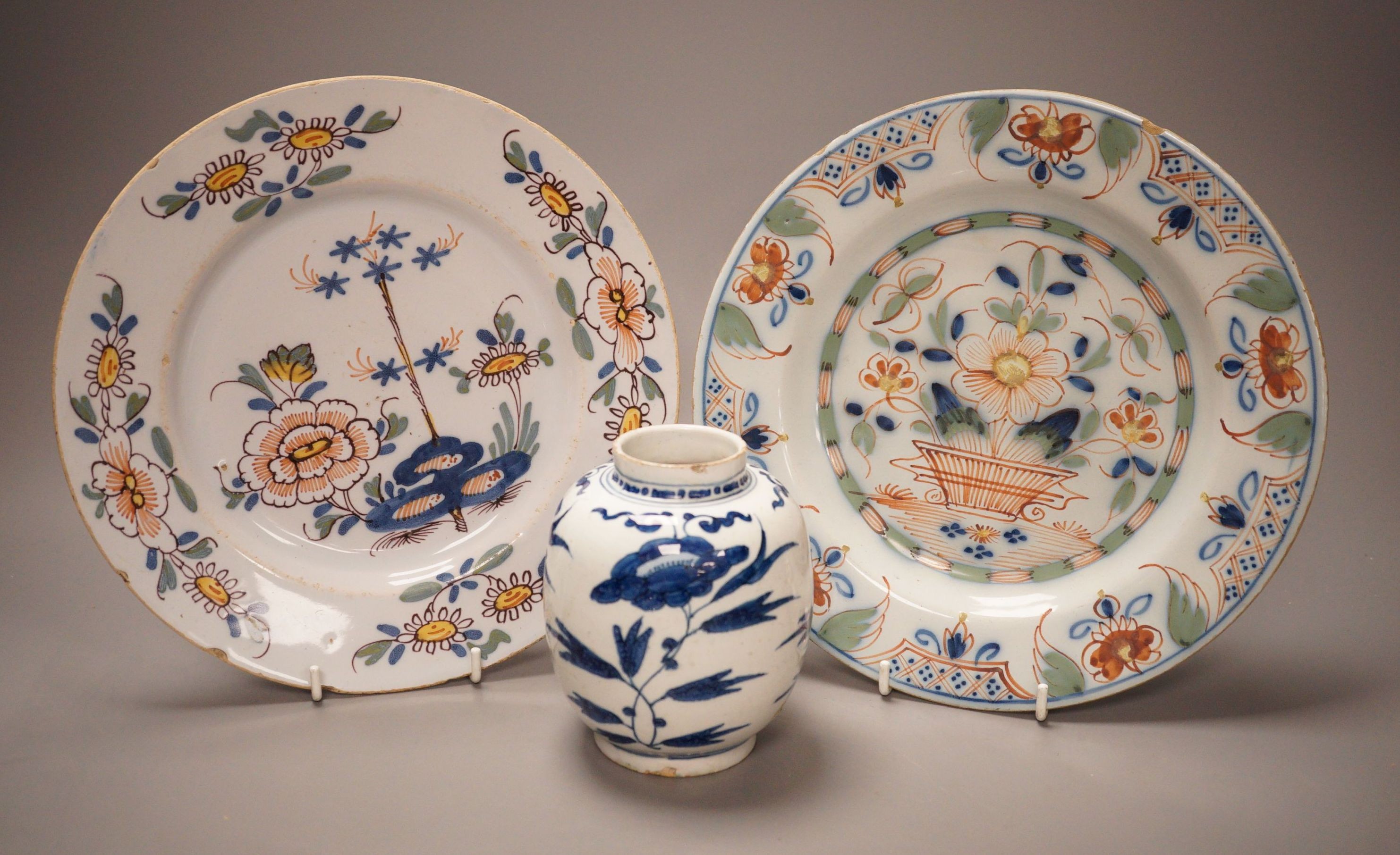 Two 18th century English delftware plates and a 18th century Delft vase, plate diameter 23cm (3)                                                                                                                            