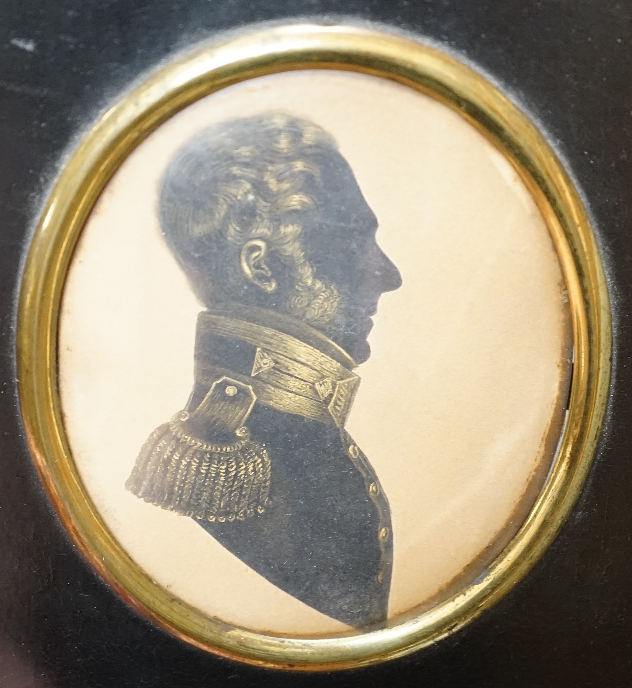 19th century, cut paper and bronzed silhouette of Capt H.Cardew, late Royal Engineers, 8.5 x 7cm, housed in an ebonised frame. Condition - fair                                                                             